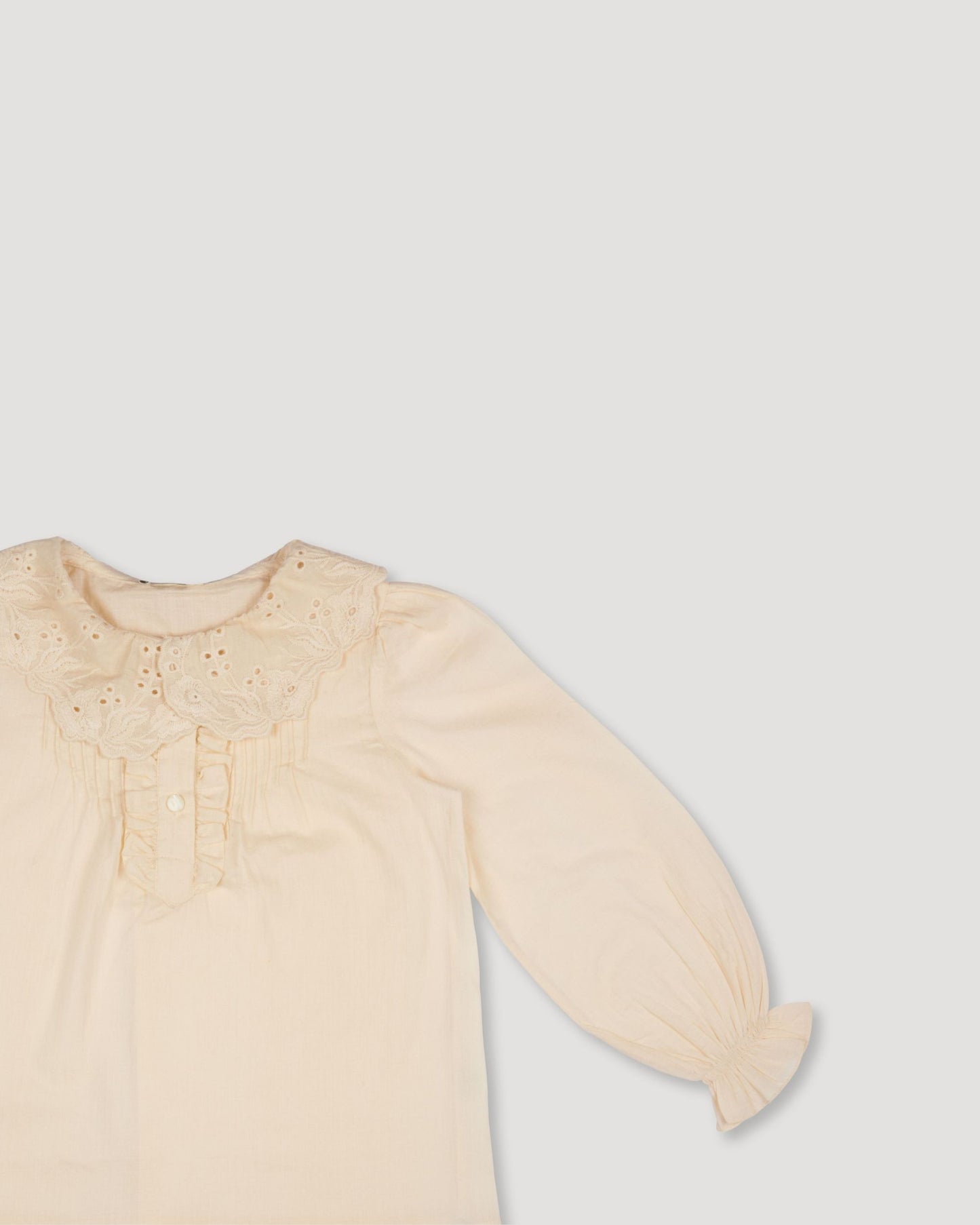 Early Sunday, Julianne Blouse in Hazelnut Cream, made from Dyed Cotton Swiss Dobby Tiny Dots fabric, featuring Comfort-first design with a playful silhouette, shown in a closeup flat-lay view