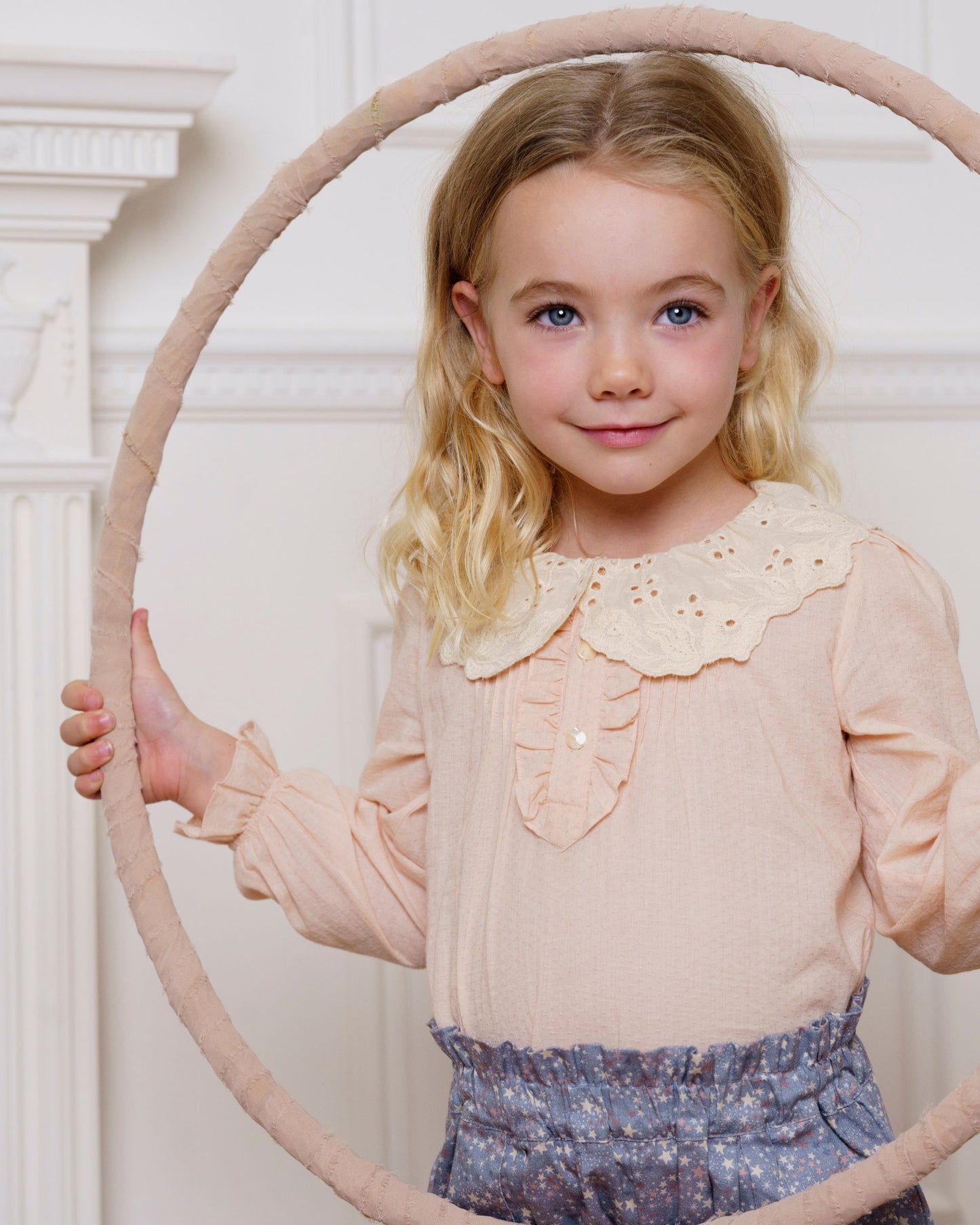 Early Sunday, Julianne Blouse in Nude, made from Dyed Cotton Swiss Dobby Tiny Dots fabric, featuring Comfort-first design with a playful silhouette, shown in a front view of model wearing it