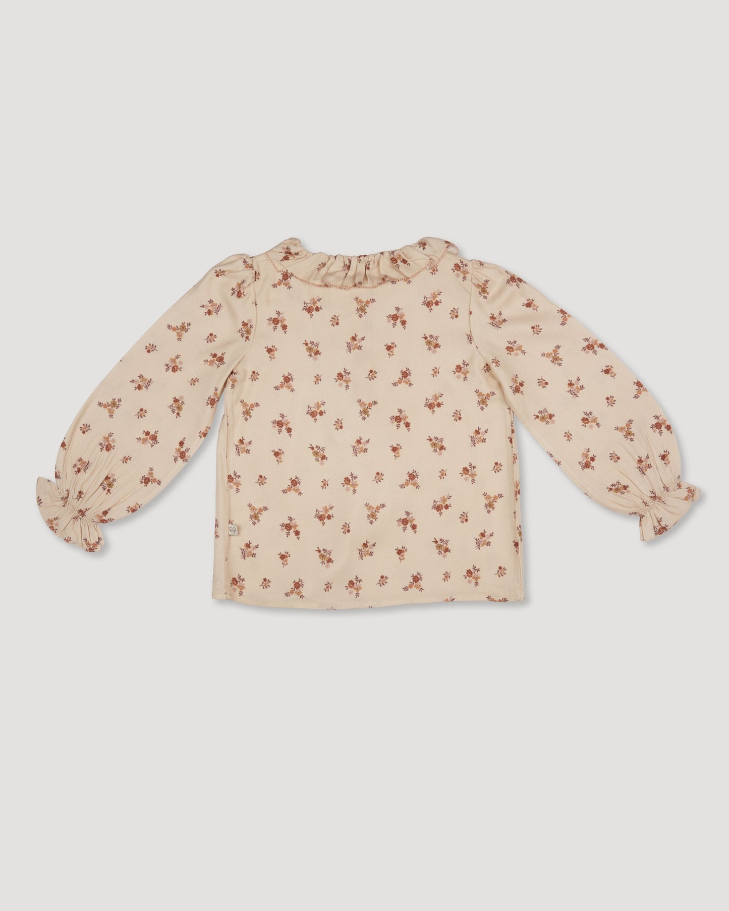 Early Sunday, Julianne Blouse in Ditsy Bouquet Cream print, made from Printed Viscose Rayon Twill fabric, featuring Comfort-first design with a playful silhouette, shown in a back flat-lay view
