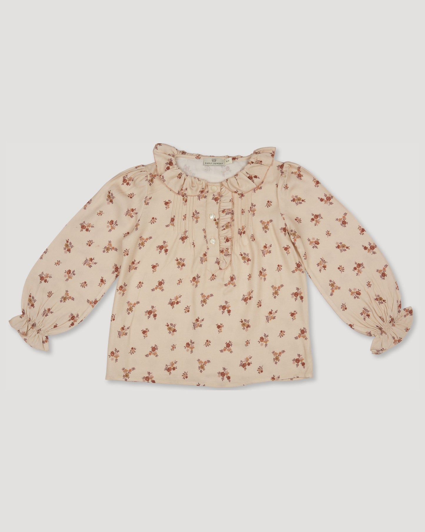 Early Sunday, Julianne Blouse in Ditsy Bouquet Cream print, made from Printed Viscose Rayon Twill fabric, featuring Comfort-first design with a playful silhouette, shown in a front flat-lay view