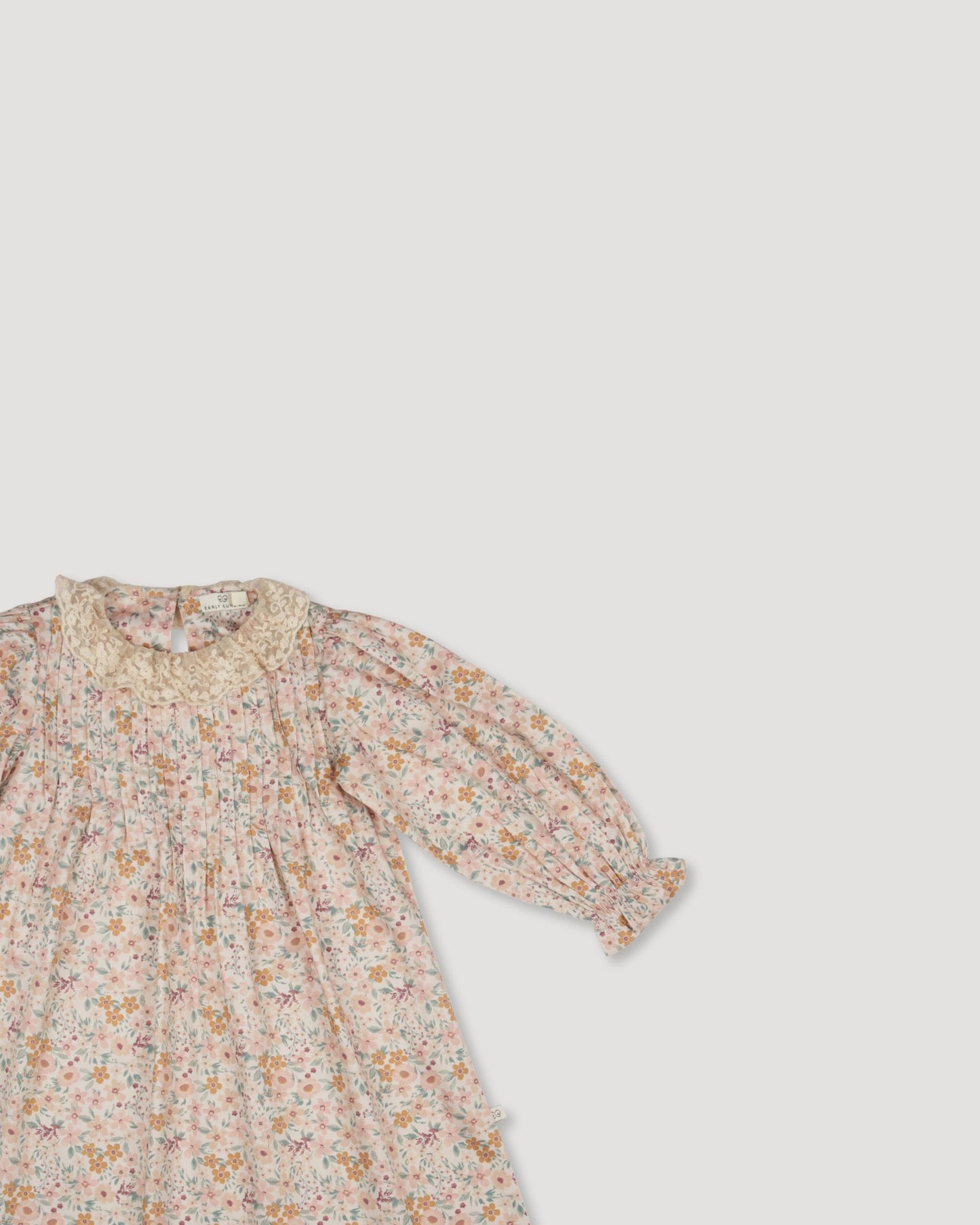 Early Sunday, Julie Dress in Floral print, made from Printed Cotton Satin fabric, featuring Delicate lace collar paired with a softly structured silhouette for a refined, timeless finish, shown in a closeup flat-lay view