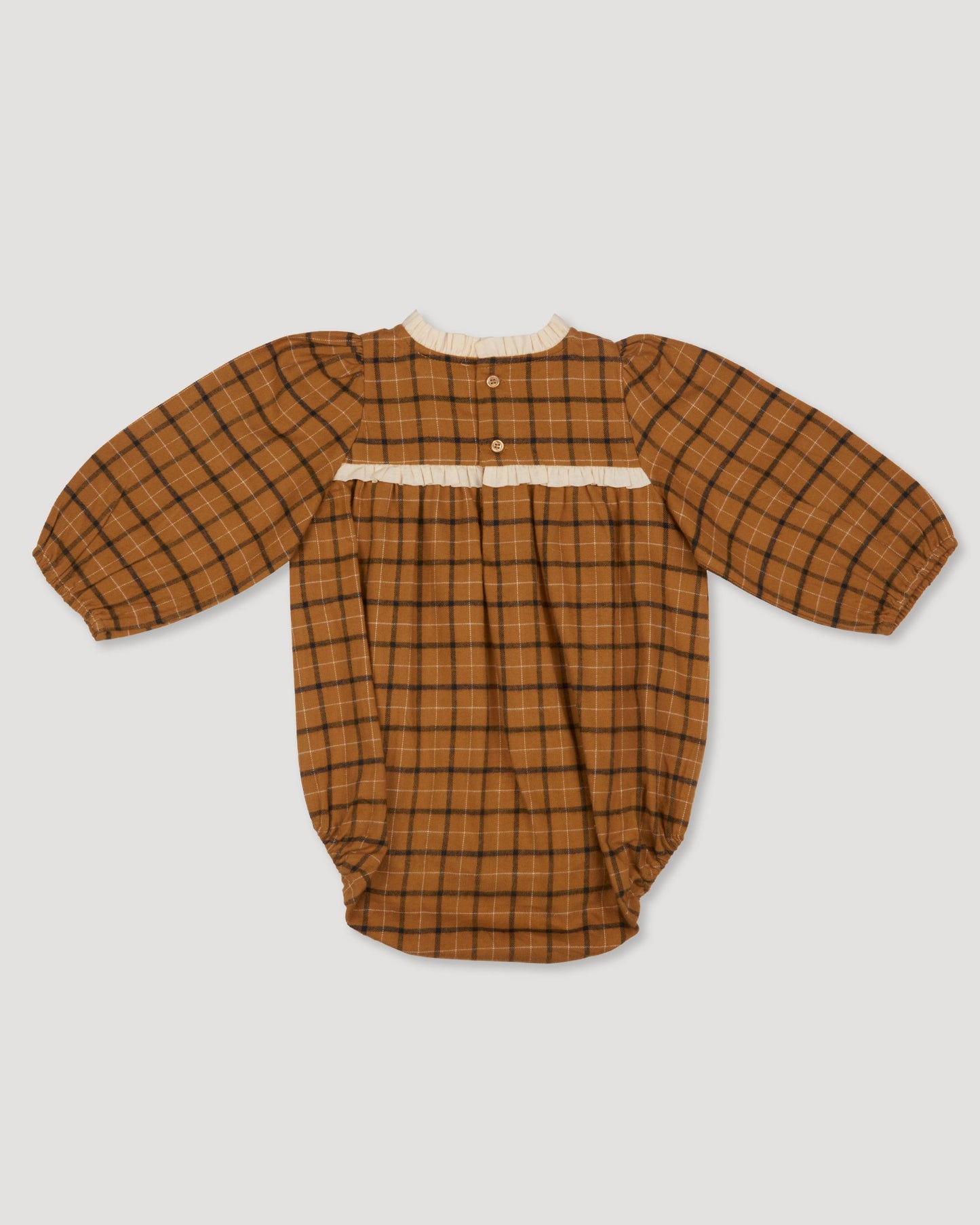 Early Sunday, Kayla Baby Romper in Almond Checks print, made from Cotton Yarn Dyed Brushed Checks fabric, featuring long gathered sleeves & frilled neckline, shown in a back flat-lay view