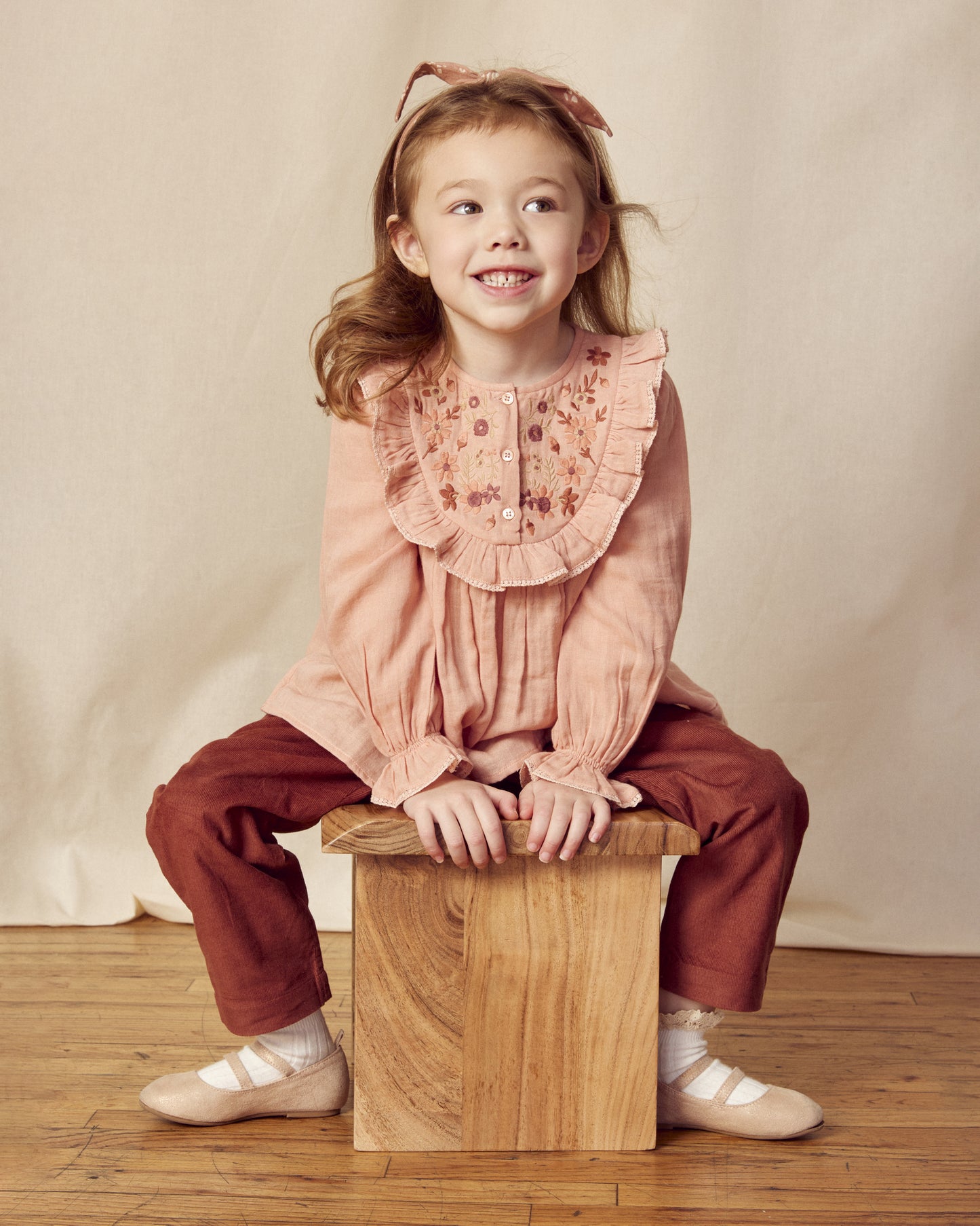 Early Sunday, Lauren Blouse in Dusty Pink, made from Cotton Double Gauze fabric, featuring relaxed fit with a floral embroidered yoke, shown in a front view of a model wearing it in a studio setting