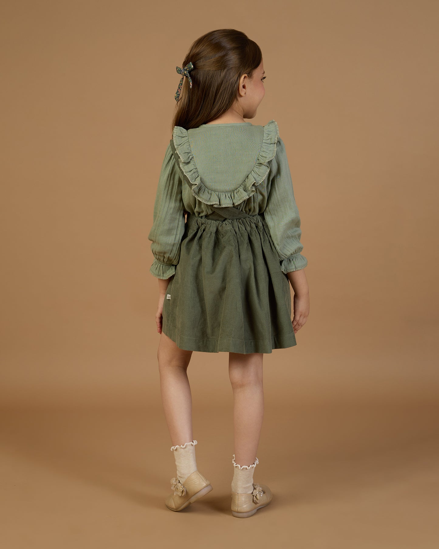 Early Sunday, Lauren Blouse in Halcyon Green color, made from Cotton Double Gauze fabric, featuring relaxed fit with a floral embroidered yoke, shown in a back view of model wearing it