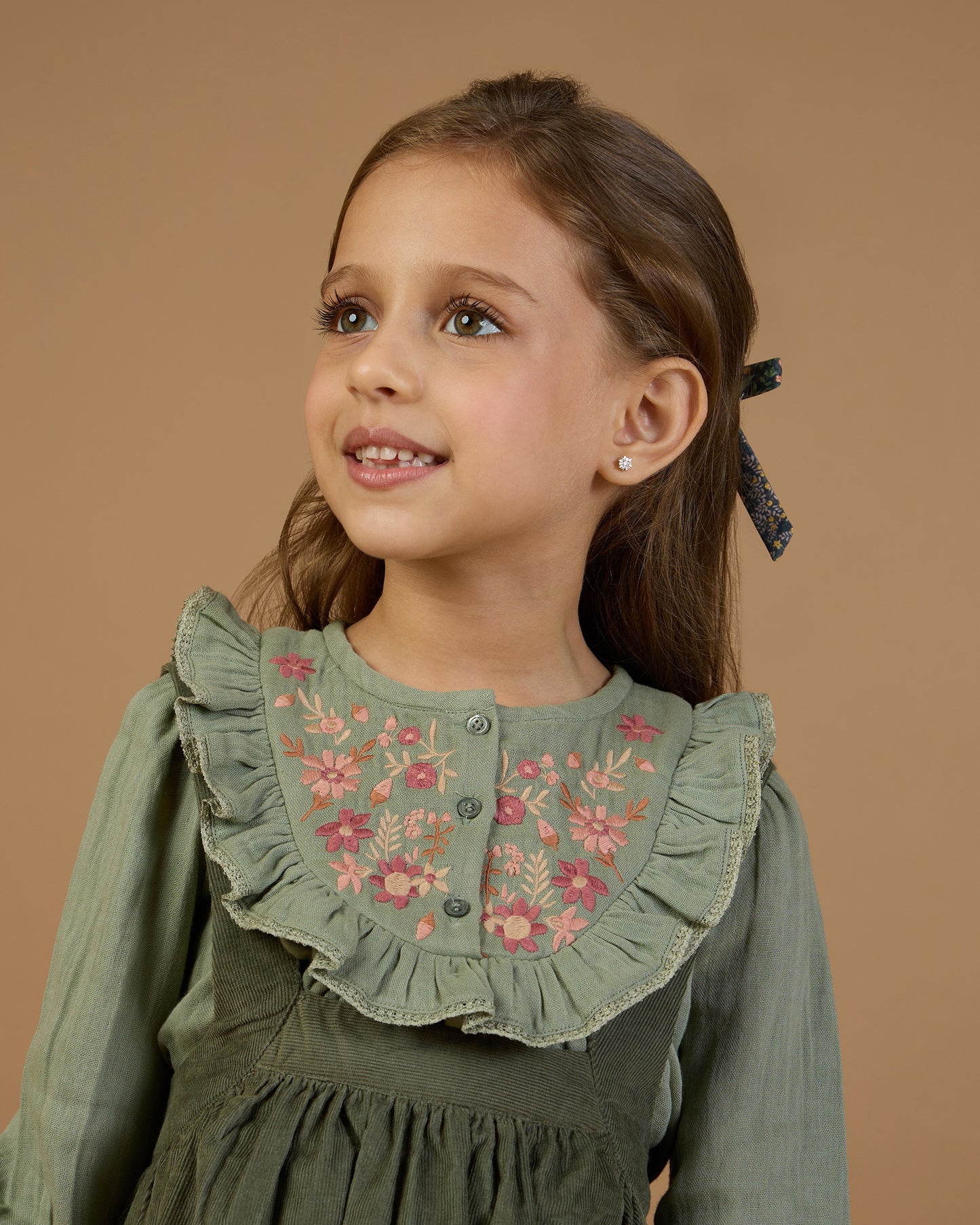 Early Sunday, Lauren Blouse in Halcyon Green color, made from Cotton Double Gauze fabric, featuring relaxed fit with a floral embroidered yoke, shown in a front view of a model wearing it in a studio setting
