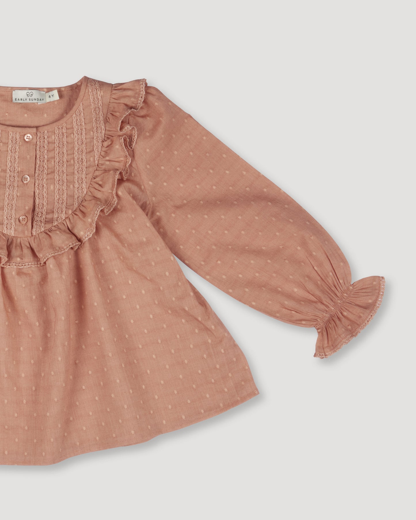 Early Sunday, Lauren Blouse in Earthy Pink, made from Cotton Swiss Dobby fabric, featuring relaxed fit with a floral embroidered yoke, shown in a closeup flat-lay view