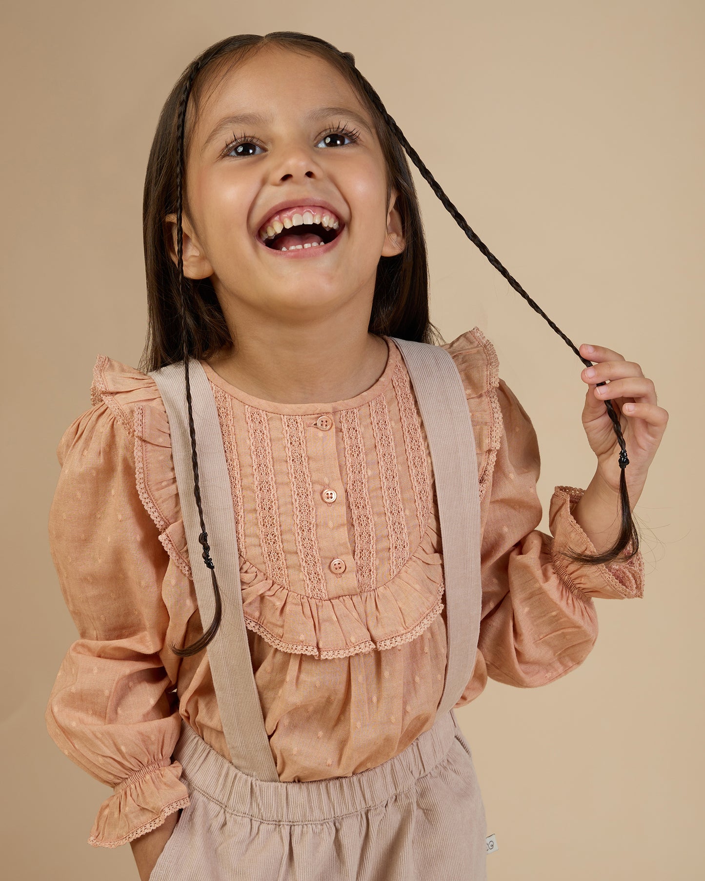 Early Sunday, Lauren Blouse in Earthy Pink, made from Cotton Swiss Dobby fabric, featuring relaxed fit with a floral embroidered yoke, shown in a front view of a model wearing it in a studio setting