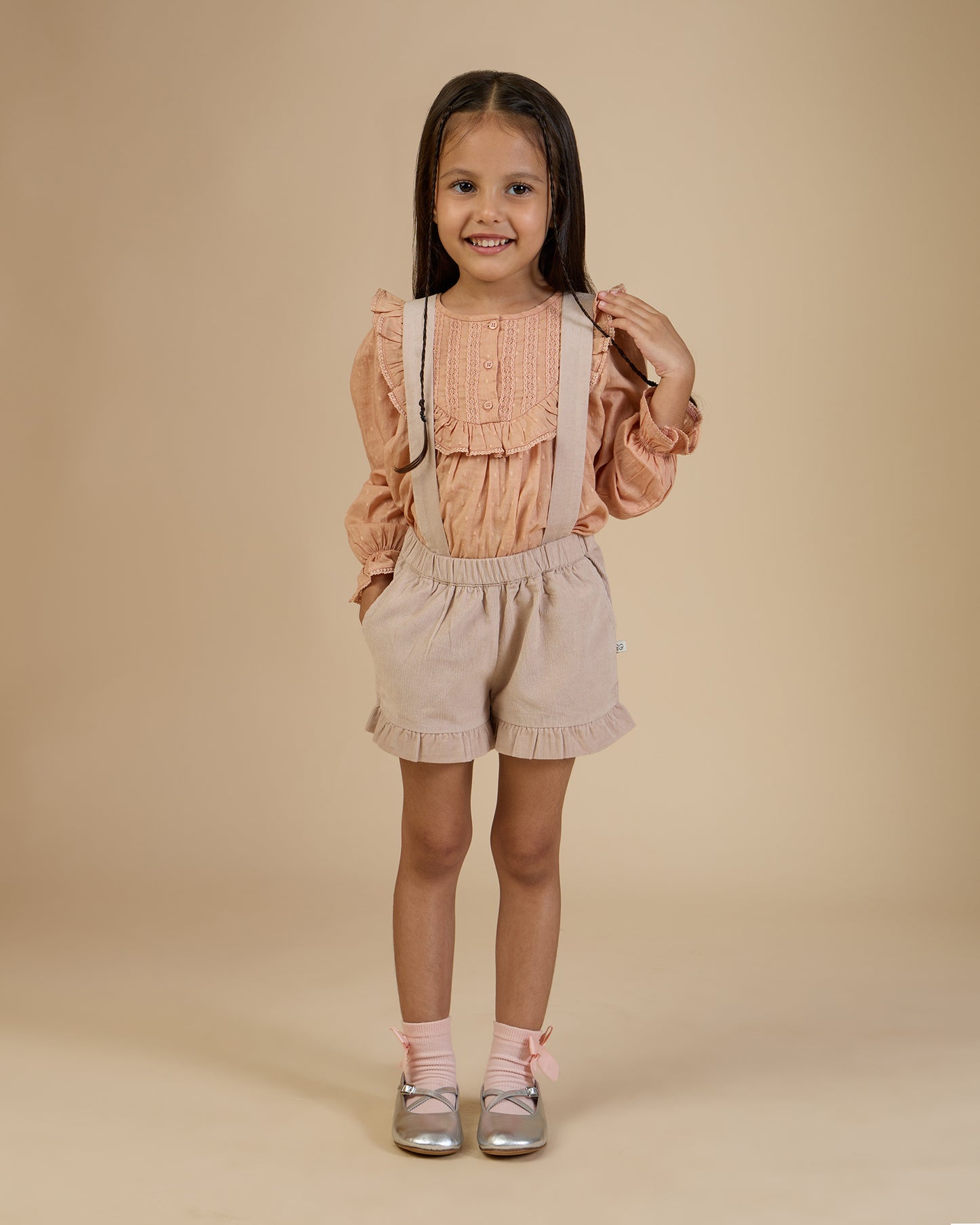 Early Sunday, Lauren Blouse in Earthy Pink, made from Cotton Swiss Dobby fabric, featuring relaxed fit with a floral embroidered yoke, shown in a front view of model wearing it