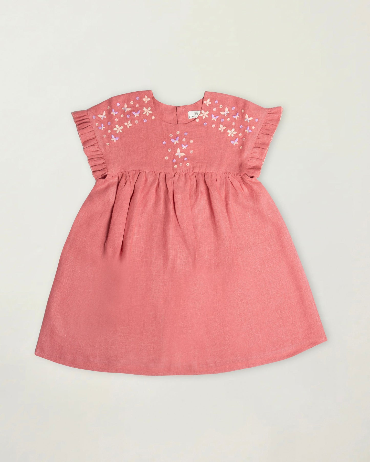Early Sunday, Lila Dress in Peony color, made from 70% cotton 30% linen solid fabric, featuring Scalloped neckline with contrast stitching, flutter sleeves, gentle gathers, and embroidered hem detail, shown in a front flat-lay view