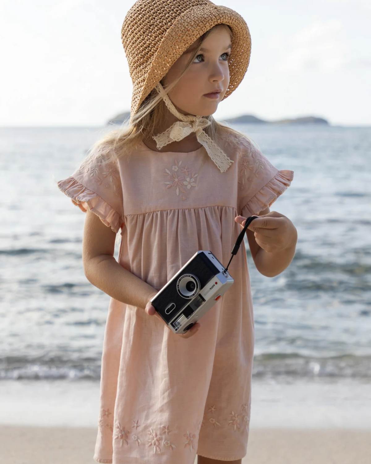 Early Sunday, Lila Dress in Pink Sand color, made from Canvas 70% Cotton 30% Linen fabric, featuring a flattering mini dress with a relaxed fit, designed for comfort and effortless style, shown in a front view of model wearing it