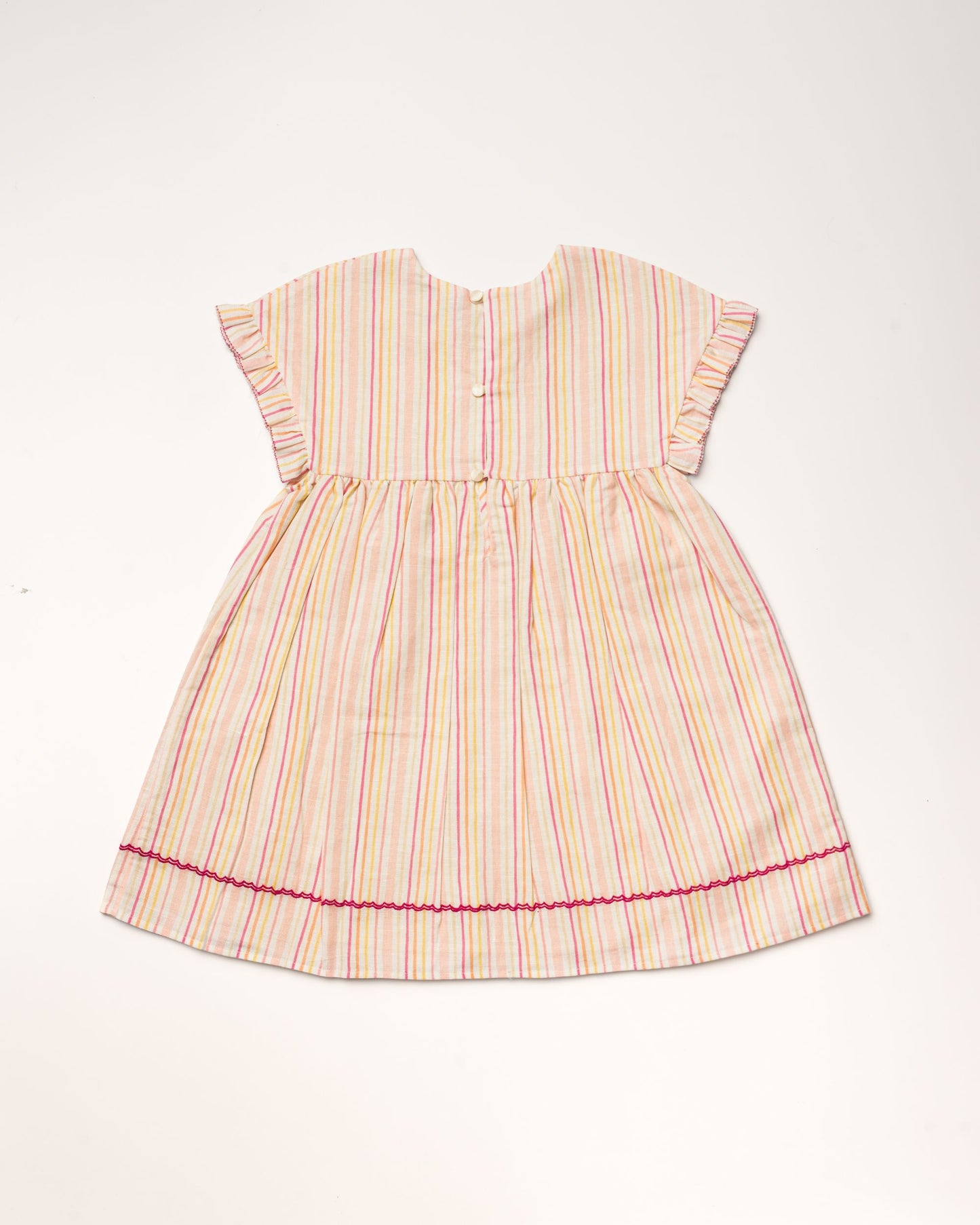 Early Sunday, Lila Dress in Pink Stripes color, made from printed 70% cotton 30% linen fabric, featuring Scalloped neckline with contrast stitching, flutter sleeves, gentle gathers, and embroidered hem detail, shown in a back flat-lay view