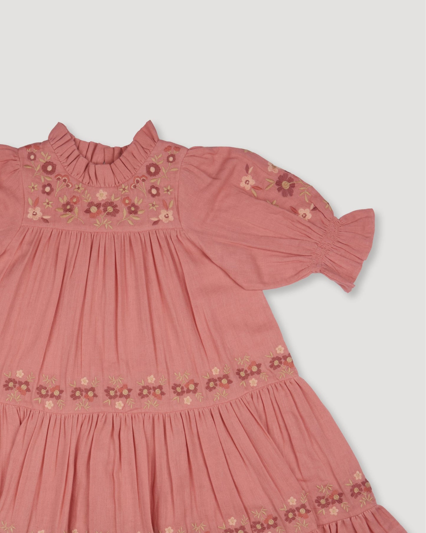 Early Sunday, Lilly Dress in Rose, made from Dyed Cotton Double Gauze fabric, featuring Delicate floral embroidery placed softly across the dress for a timeless, heirloom-inspired finish, shown in a closeup flat-lay view