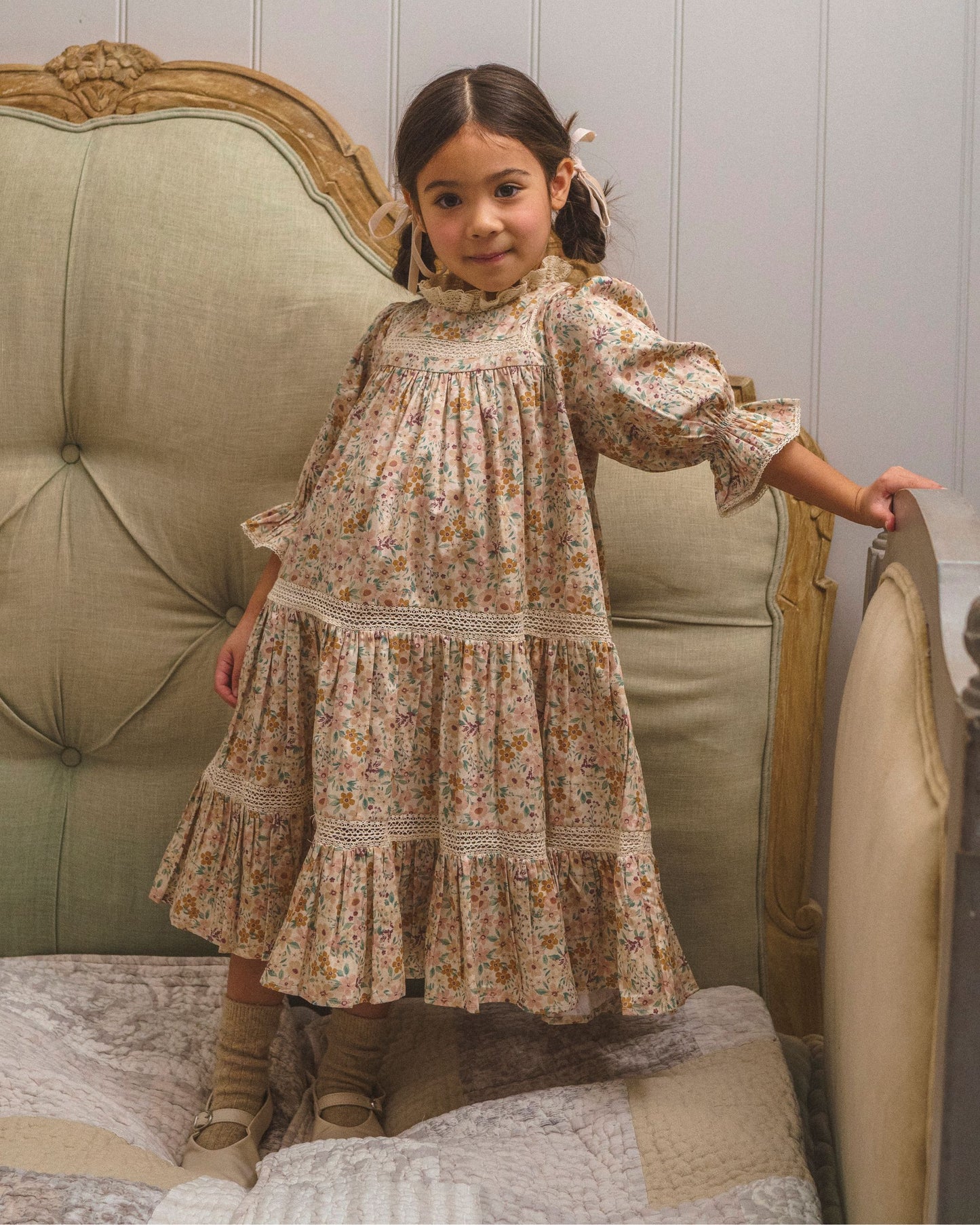 Early Sunday, Lilly Dress in Floral print, made from Printed Cotton Satin fabric, featuring Delicate floral embroidery placed softly across the dress for a timeless, heirloom-inspired finish, shown in a front view of model wearing it