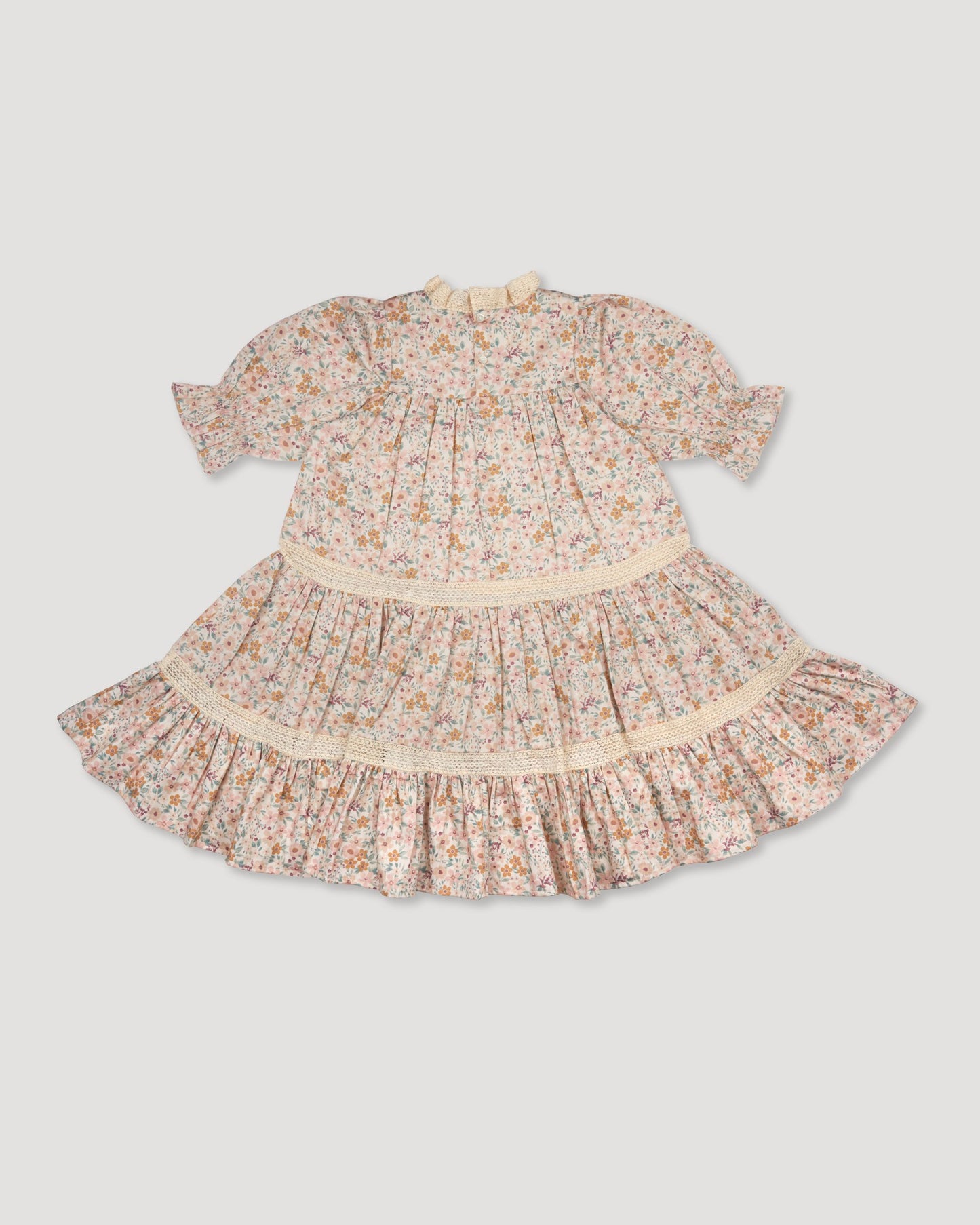 Early Sunday, Lilly Dress in Floral print, made from Printed Cotton Satin fabric, featuring Delicate floral embroidery placed softly across the dress for a timeless, heirloom-inspired finish, shown in a back flat-lay view