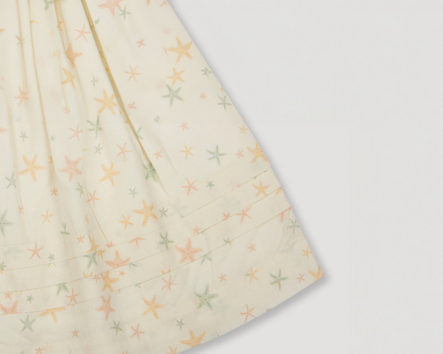 Early Sunday, Luna Skirt in Star Fish print, made from Printed Cotton Cambric fabric, featuring flattering silhouette with an easy fit, shown in a close-up of print