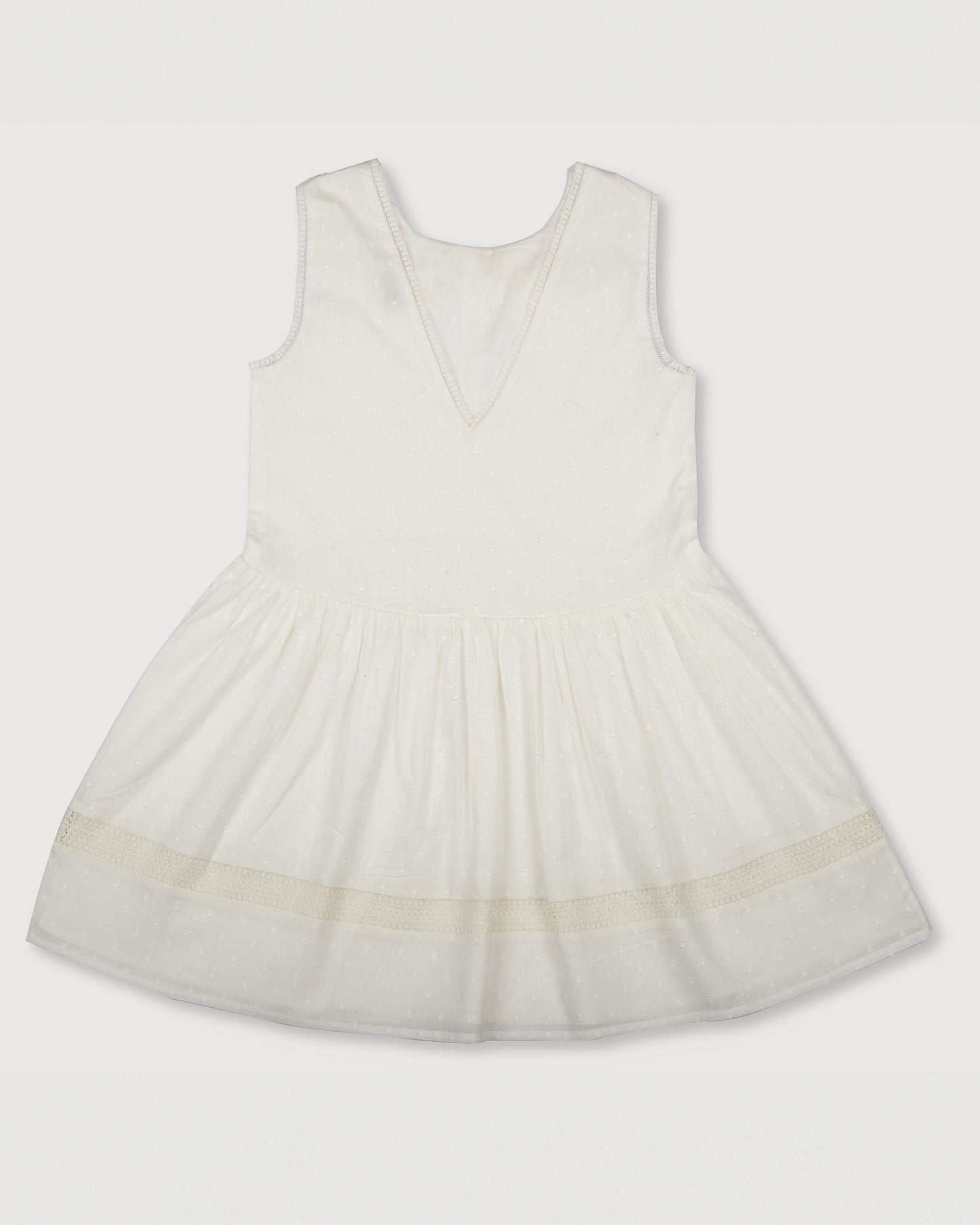 Early Sunday, LYS Dress in Ivory color, made from Cotton Dobby Swiss Dots fabric, featuring flattering fit with delicate finishes, combining style and functionality for an effortlessly elegant look, shown in a back flat-lay view