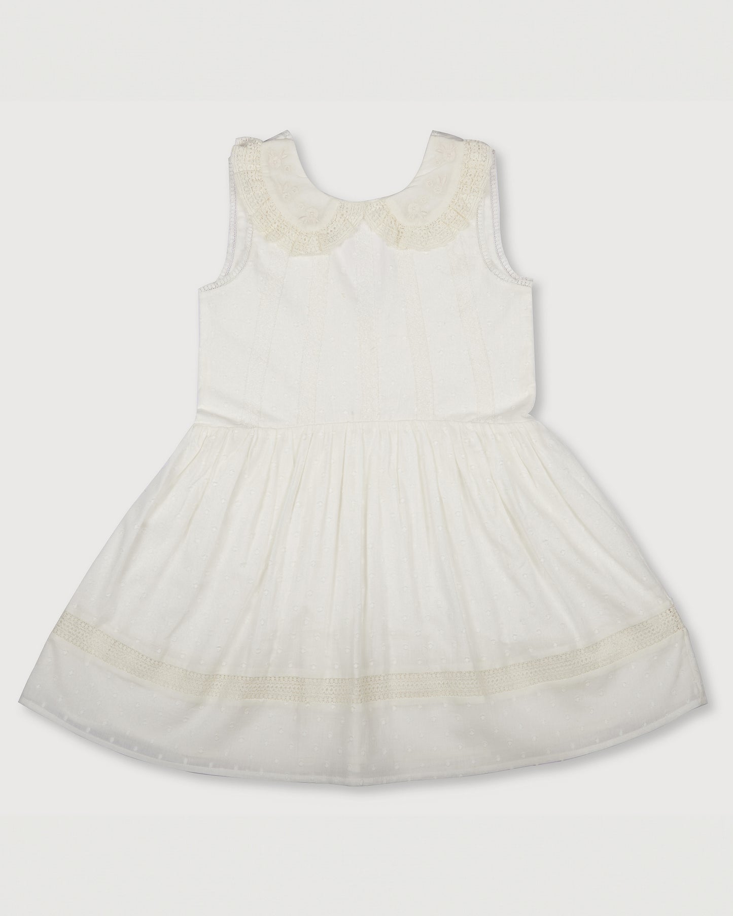 Early Sunday, LYS Dress in Ivory color, made from Cotton Dobby Swiss Dots fabric, featuring flattering fit with delicate finishes, combining style and functionality for an effortlessly elegant look, shown in a front flat-lay view