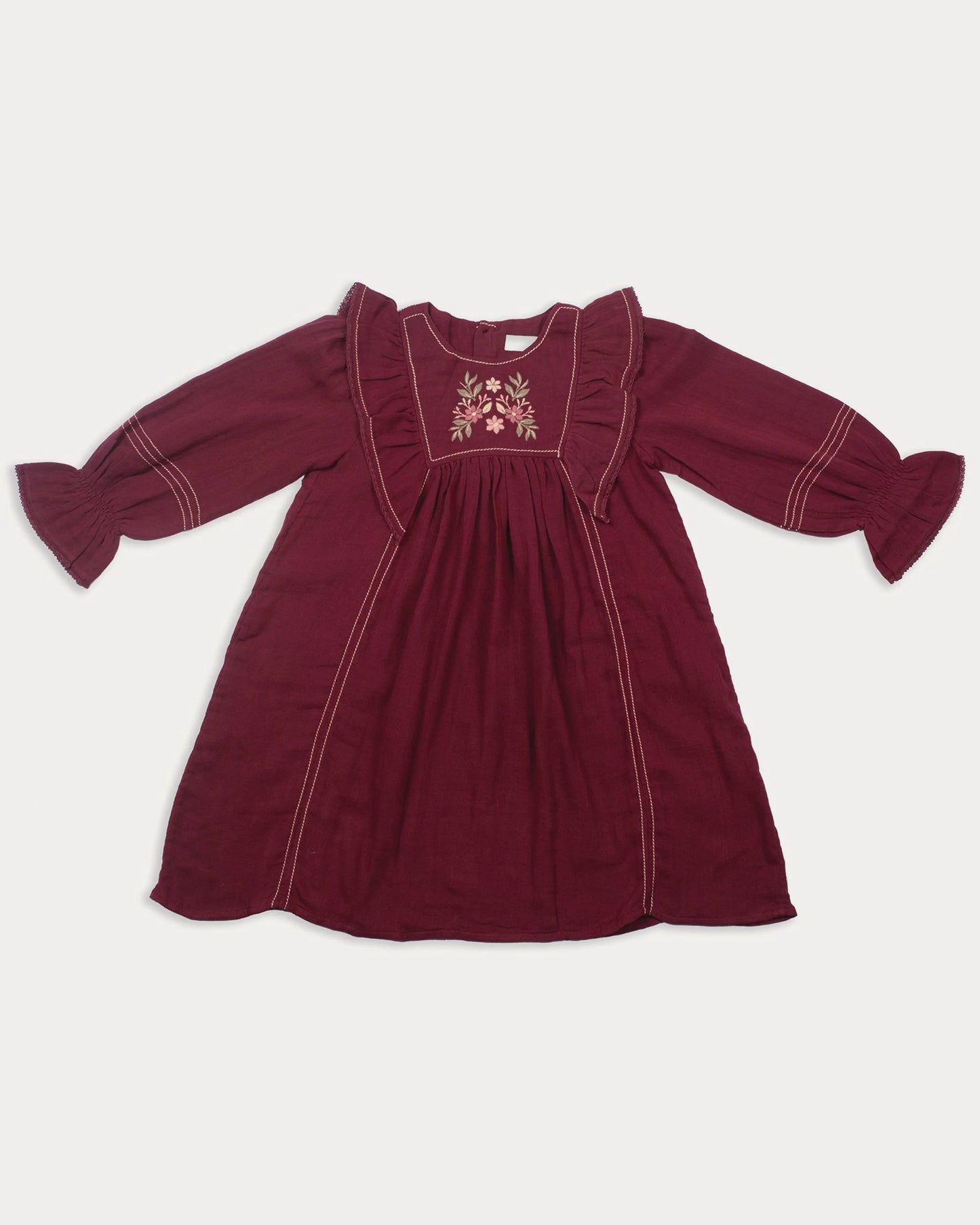 Early Sunday, Margot Dress in Plum, made from Cotton Double Gauze fabric, featuring classic silhouette with ruffle detailing around the sleeves, shown in a front flat-lay view