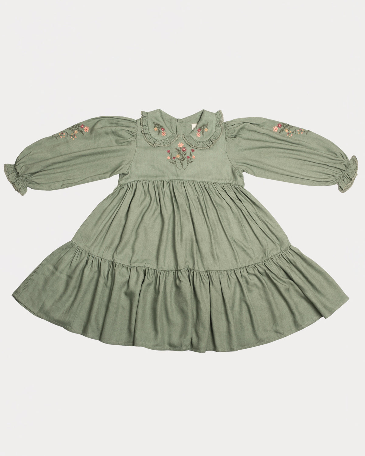 Early Sunday, Marguerite Dress in Sage Green, made from Viscose Drapey Twill fabric, featuring floral embroidery with frilled Peter Pan collar and gathered sleeves, shown in a front flat-lay view