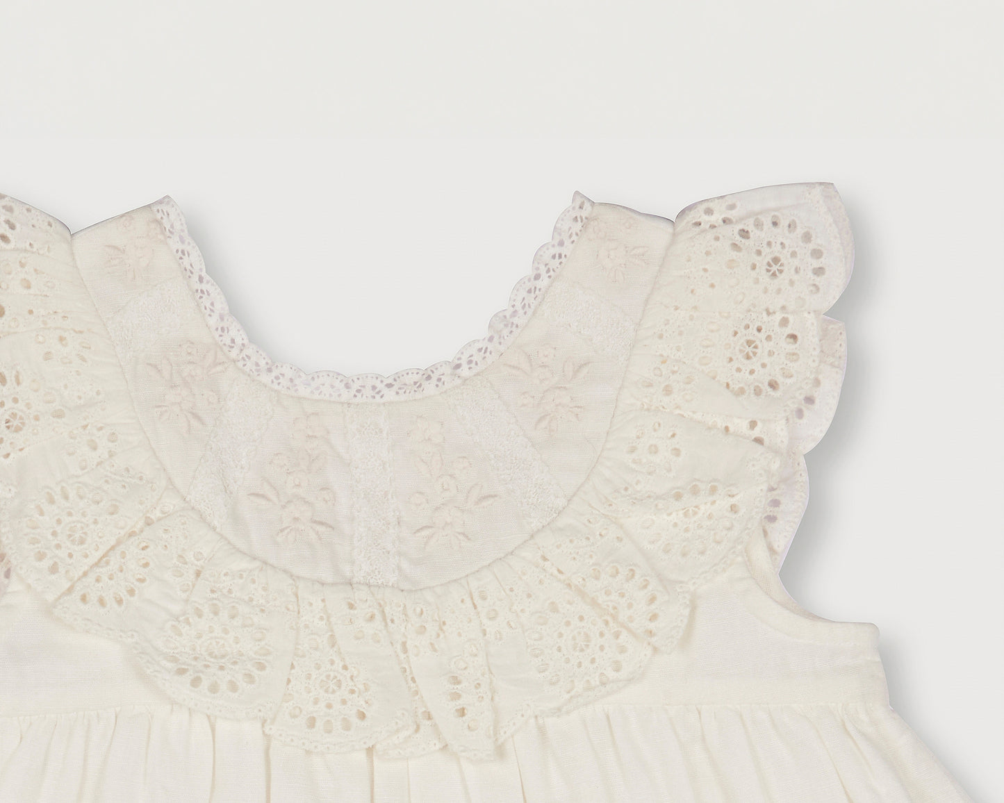 Early Sunday, Natasha Dress in Ivory color, made from 70% Cotton x 30% Linen fabric, featuring flattering fit with delicate finishes, combining style and functionality for an effortlessly elegant look, shown in a closeup flat-lay view