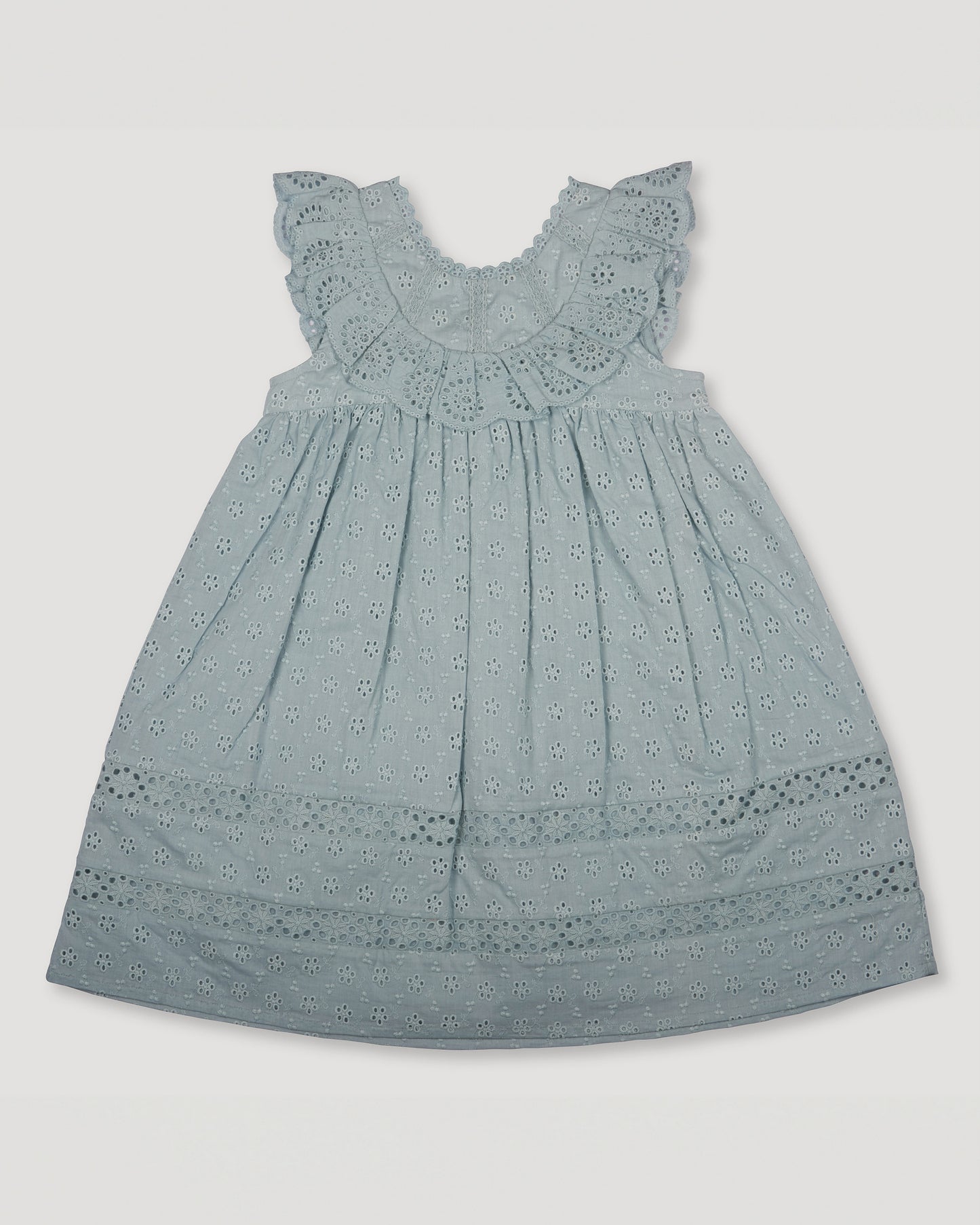 Early Sunday, Natasha Dress in Sea Dream color, made from All-Over Eyelet Embroidered Cotton Schifflie fabric, featuring flattering fit with delicate finishes, combining style and functionality for an effortlessly elegant look, shown in a front flat-lay view