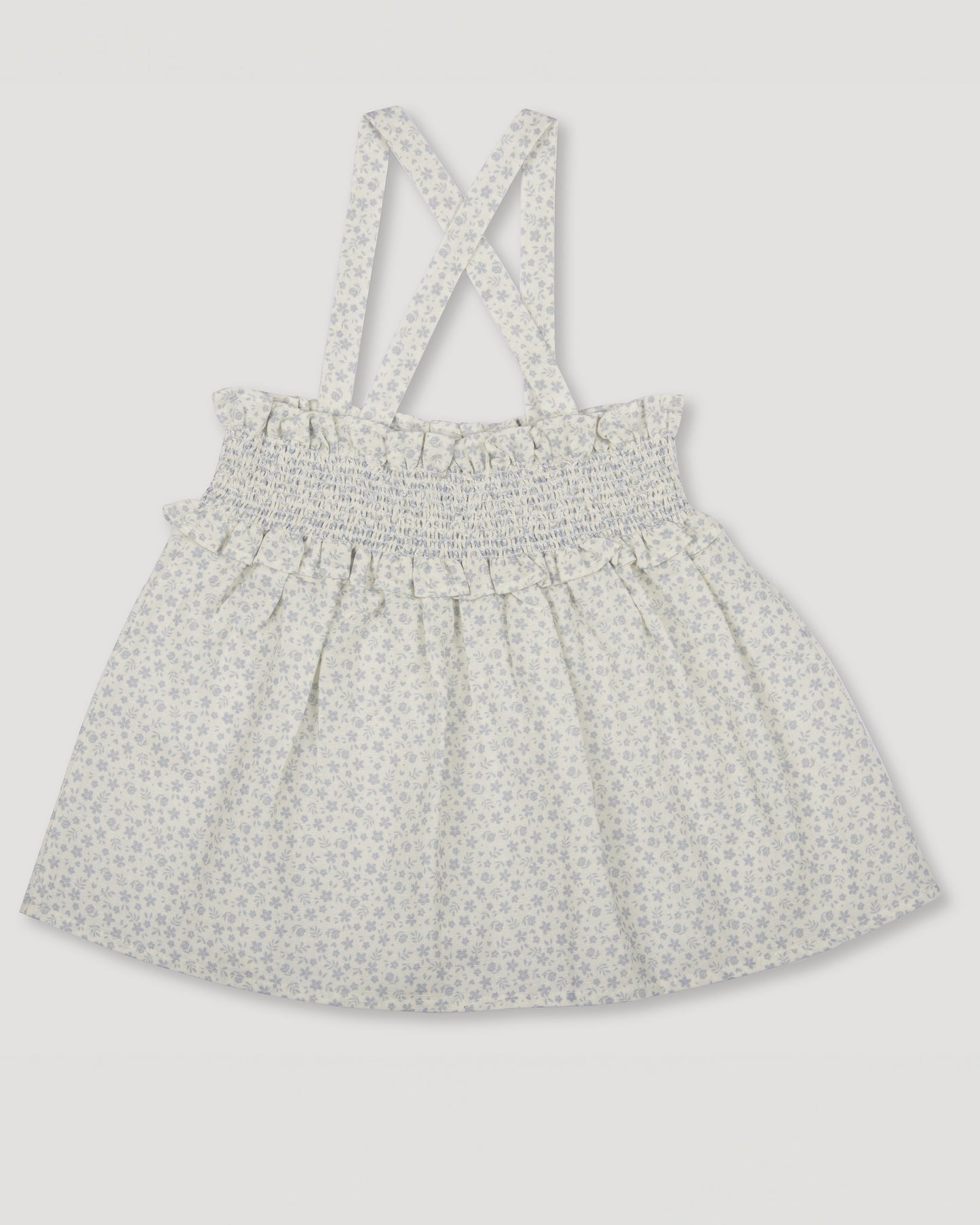 Early Sunday, Olivia Blouse in Mini Flower print, made from Printed canvas 70% Cotton 30% Linen fabric, featuring smocked bodice for a flexible fit, cross-back straps and a flared hem shown in a front flat-lay view