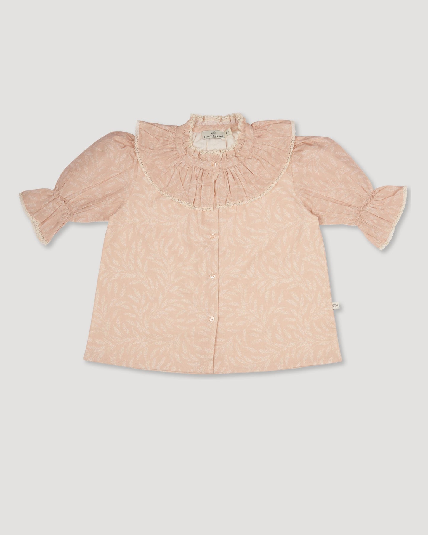 Early Sunday, Ophelie Blouse in Feather print, made from Printed Cotton Cambric fabric, featuring Comfort-first design with a playful silhouette and French seams, shown in a front flat-lay view