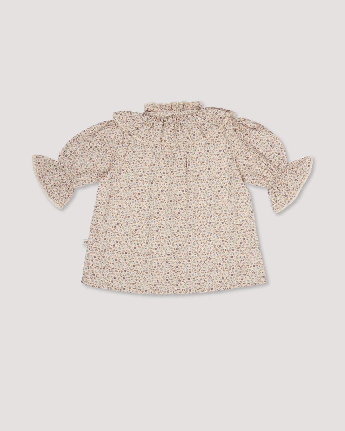 Early Sunday, Ophelie Blouse in Miny Flowers print, made from Printed Cotton Satin fabric, featuring Comfort-first design with a playful silhouette and French seams, shown in a back flat-lay view