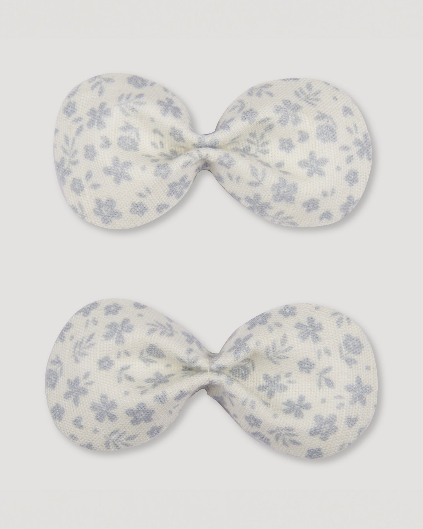 Early Sunday, Penelope Alligator Clip in Mini Flower print, made from Printed canvas 70% Cotton 30% Linen fabric, featuring a fabric bow design with a secure hair clip fastening, shown in a front flat-lay view