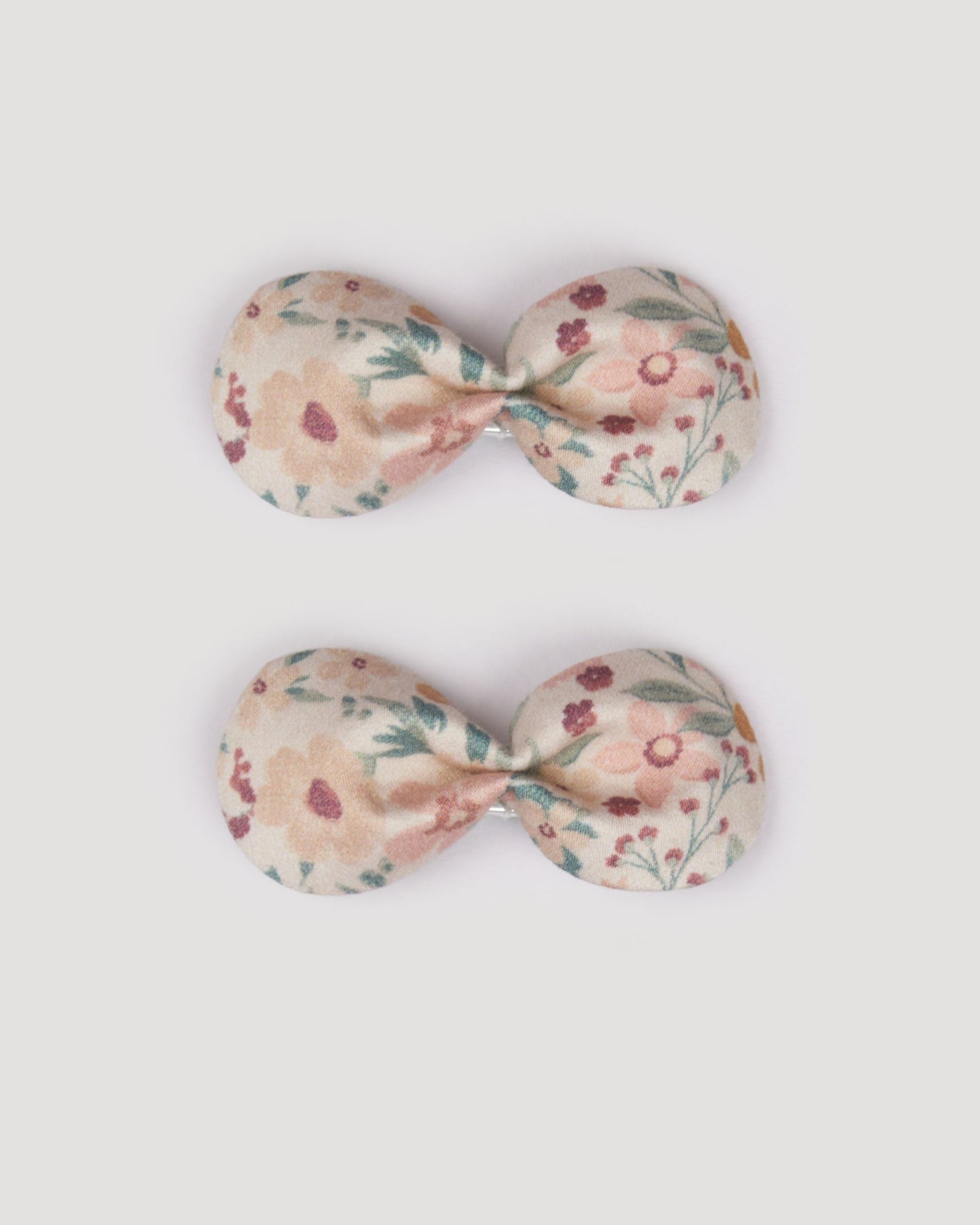 Early Sunday, Penelope Clip in Floral print, made from Printed 60s Cotton Satin fabric, featuring a set of two bow clips with a secure fit, shown in a front flat-lay view