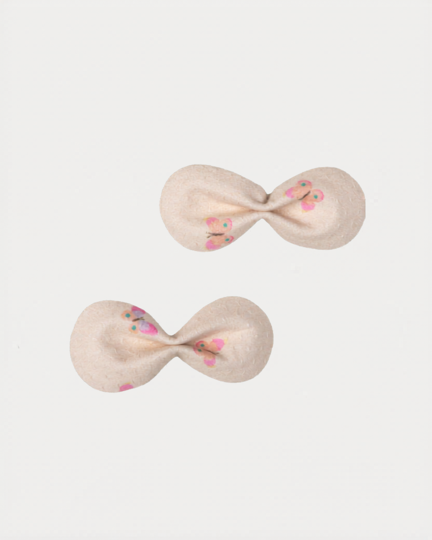 Early Sunday, Penelope Clip in Butterflies print, made from Printed Cotton Tiny Swiss Dobby fabric, featuring a set of two bow clips with a secure fit, shown in a front flat-lay view