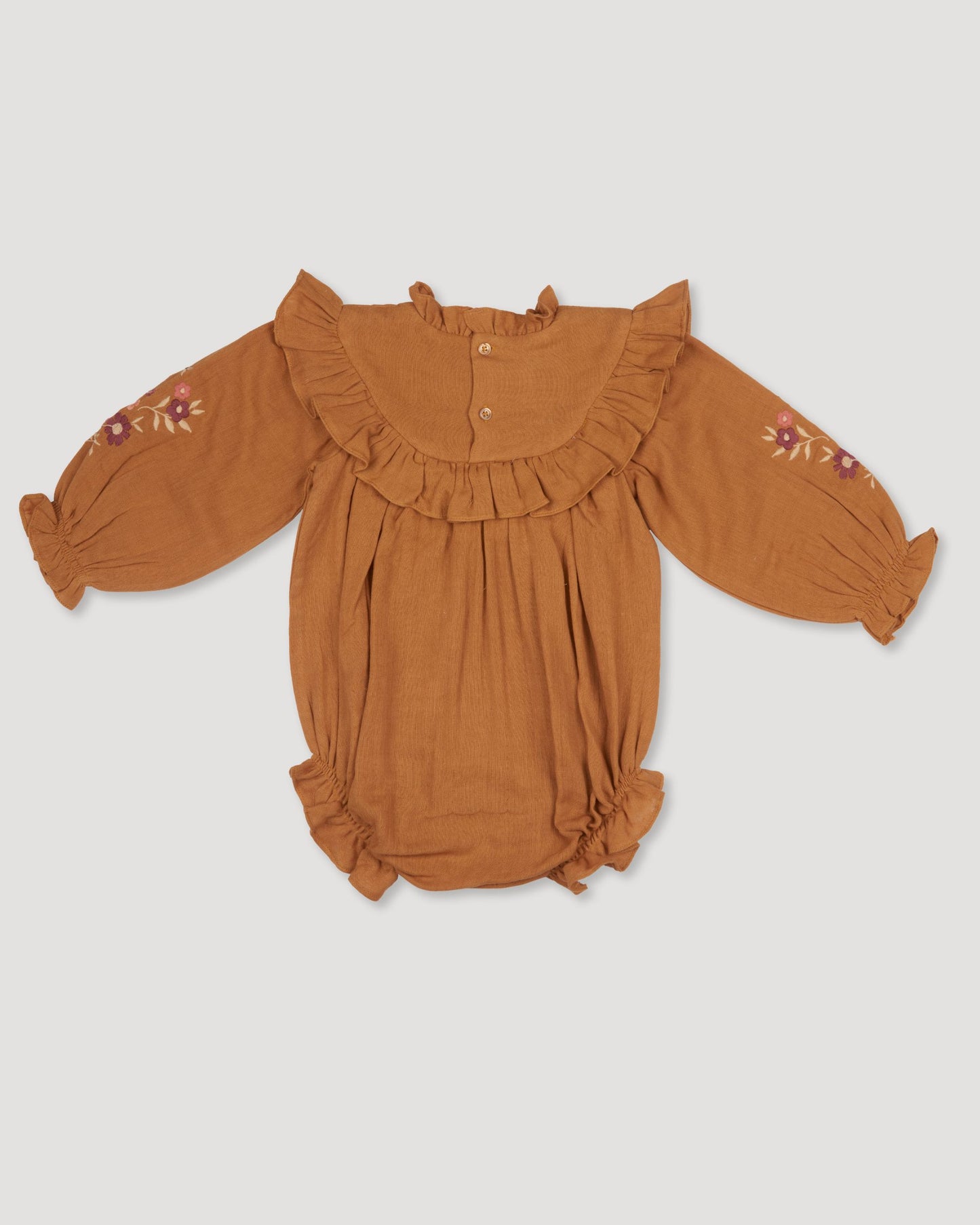 Early Sunday, Pippa Baby Bubble Romper in Almond color, made from Dyed Cotton Double Gauze fabric, featuring beautiful embroidery with frilly neck, shown in a back flat-lay view