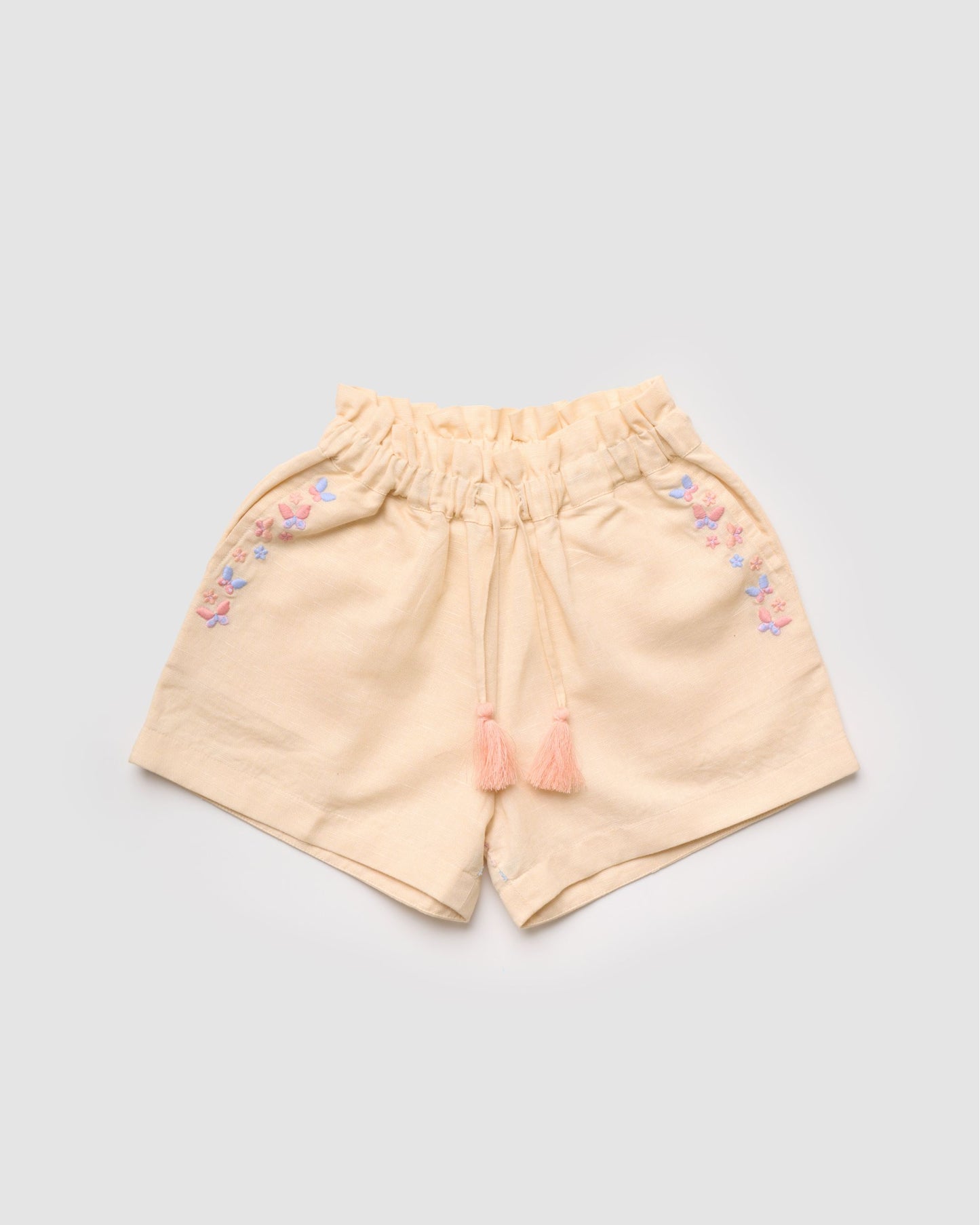 Early Sunday, Roman Short in Sand color, made from 70% Cotton 30% Linen fabric, featuring a relaxed fit with an elastic waistband & beautiful embroidery, shown in a front flat-lay view