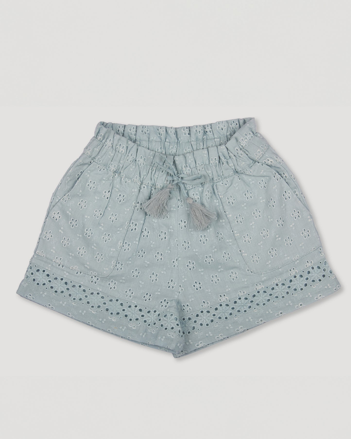 Early Sunday, Roman Shorts in Sea Dream color, made from All-Over Eyelet Embroidered Cotton Schifflie fabric, featuring relaxed fit with delicate finishes, combining style and functionality, shown in a front flat-lay view