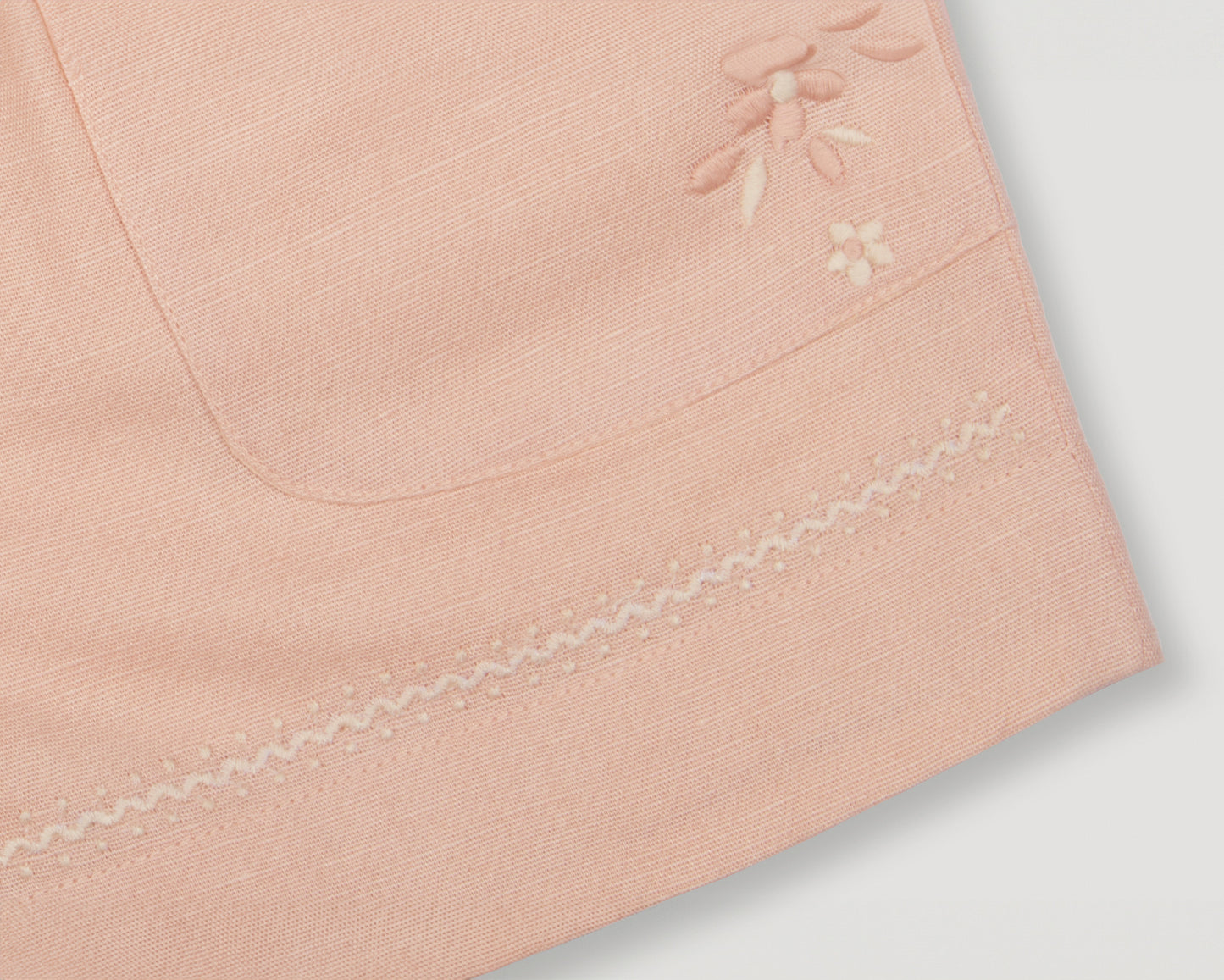 Early Sunday, Roman Shorts in Pink Sand color, made from Canvas 70% Cotton 30% Linen fabric, featuring relaxed fit with delicate finishes, combining style and functionality, shown in a detailed flat-lay view