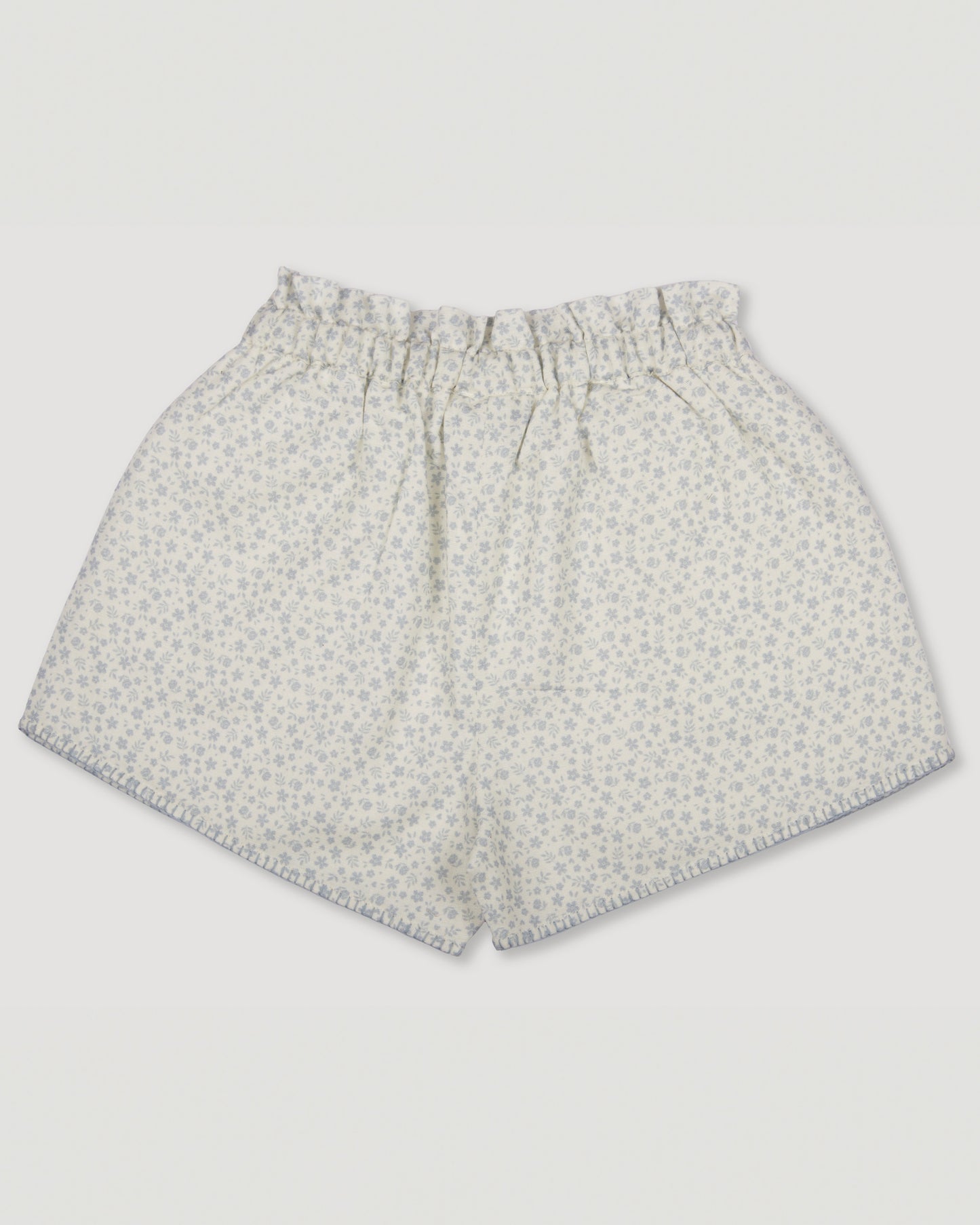 Early Sunday, Roman Shorts in Mini Flower print, made from Printed canvas 70% Cotton 30% Linen fabric, featuring relaxed fit with delicate finishes, combining style and functionality, shown in a back flat-lay view