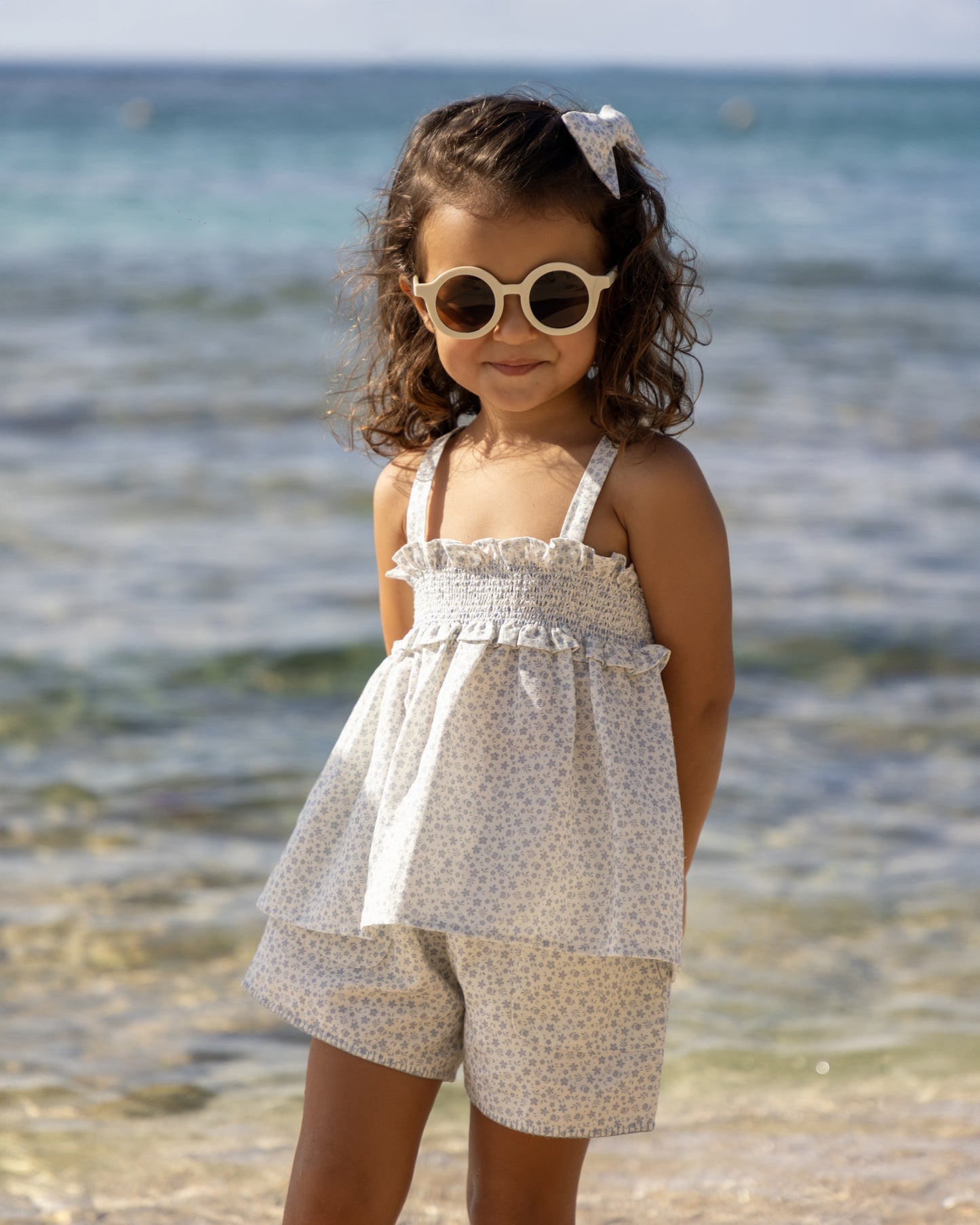 Early Sunday, Roman Shorts in Mini Flower print, made from Printed canvas 70% Cotton 30% Linen fabric, featuring relaxed fit with delicate finishes, combining style and functionality, shown in a front view of model wearing it