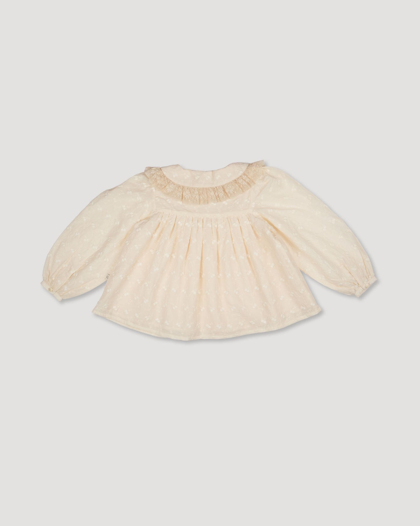 Early Sunday, Rosa Blouse in Hazelnut Cream, made from All-Over Embroidered Cotton Cambric fabric, featuring Frilled neckline detailed with a lace collar for a vintage touch, shown in a back flat-lay view
