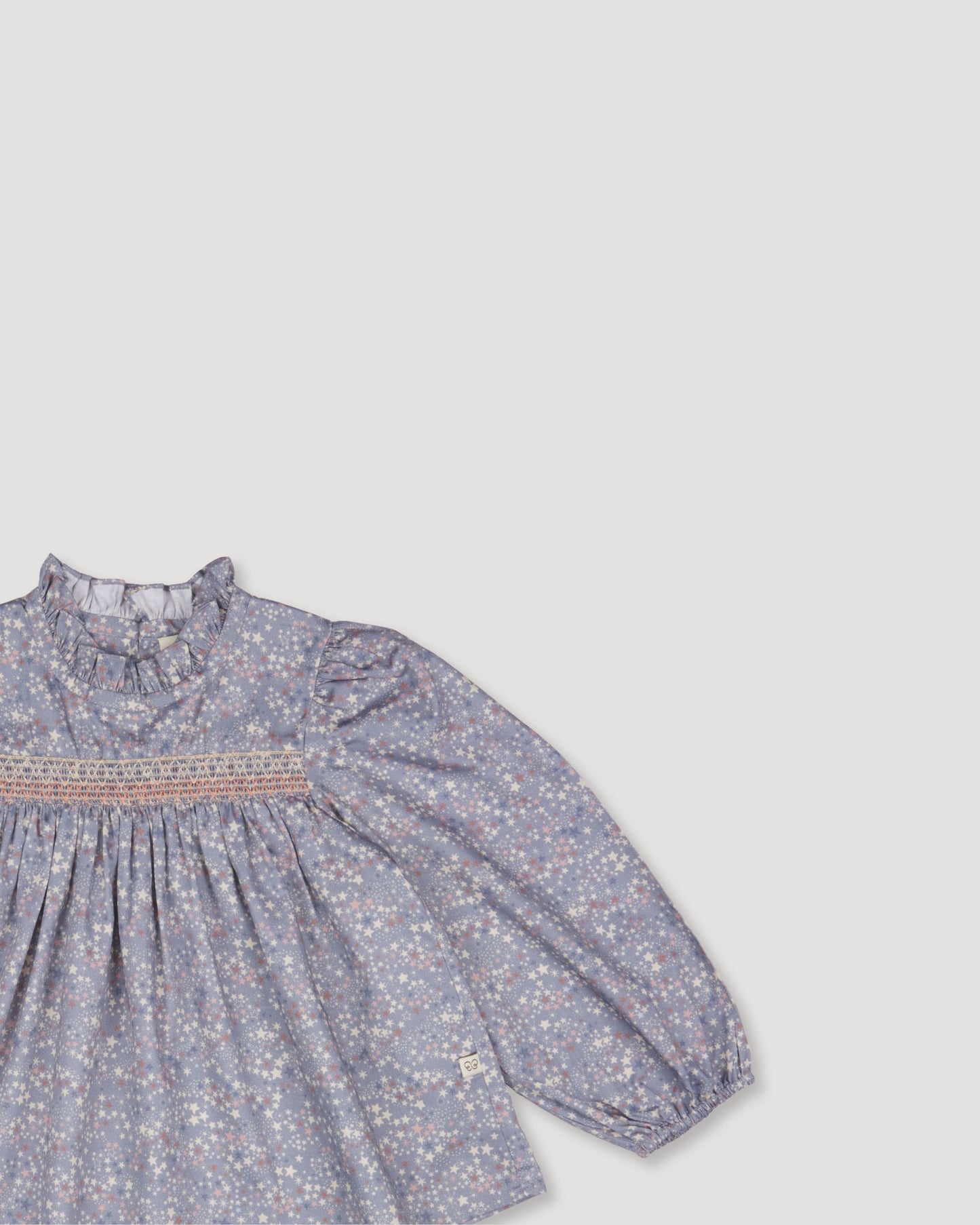 Early Sunday, Rosa Blouse in Celestial print, made from Printed Cotton Satin fabric, featuring Frilled neckline detailed with a lace collar for a vintage touch, shown in a closeup flat-lay view