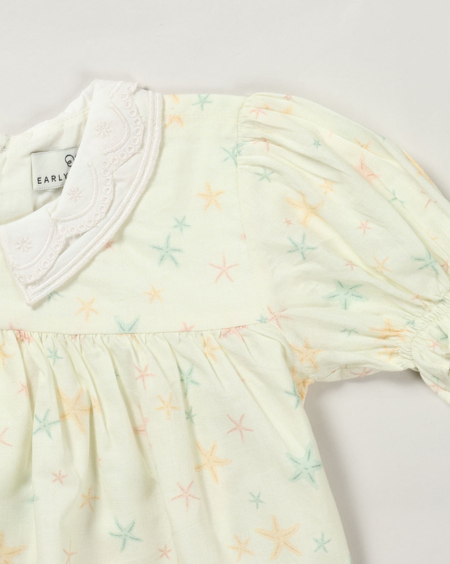Early Sunday, Sukie Baby Dress & Bloomer in Star Fish print, made from Printed Cotton Cambric fabric, featuring flared dress with a relaxed fit for ease of movement, matching bloomer with an elasticated waistband for comfort and flexibility., shown in a closeup flat-lay view