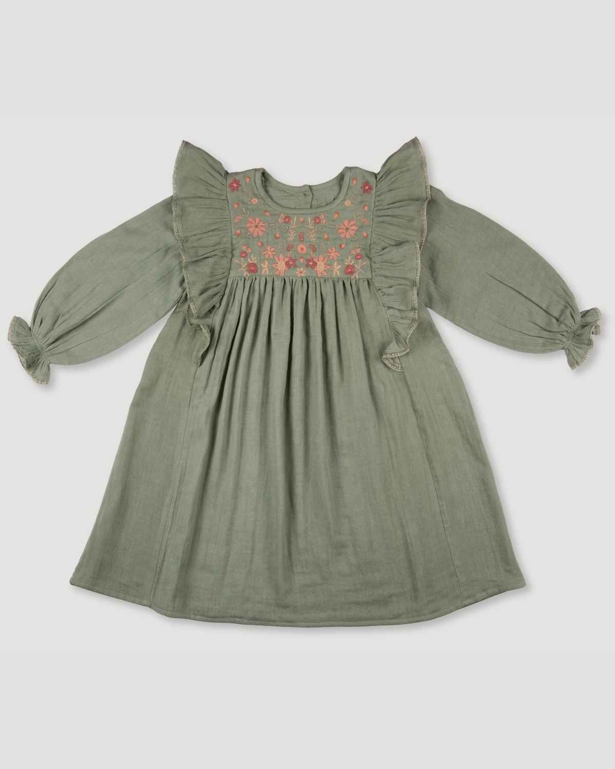 Early Sunday, Suzanne Dress in Halcyon Green, made from Cotton Double Gauze fabric, featuring classic silhouette with floral embroidery around the yoke and ruffle detailing, shown in a front flat-lay view