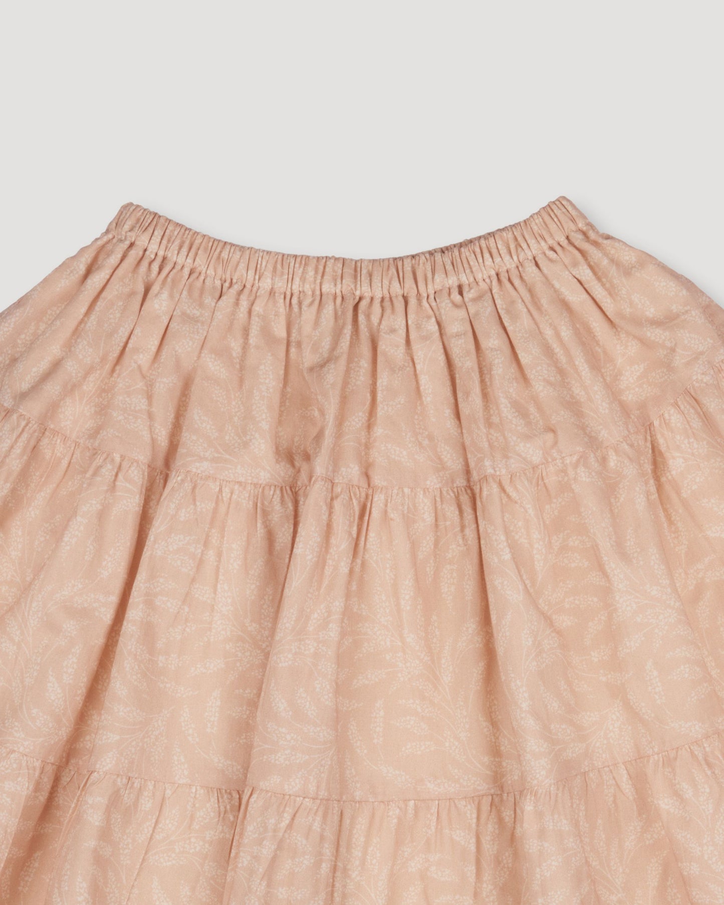Early Sunday, Victoria Skirt in Feather print, made from Printed Cotton Cambric fabric, featuring Tiered silhouette for natural movement and volume, shown in a closeup flat-lay view