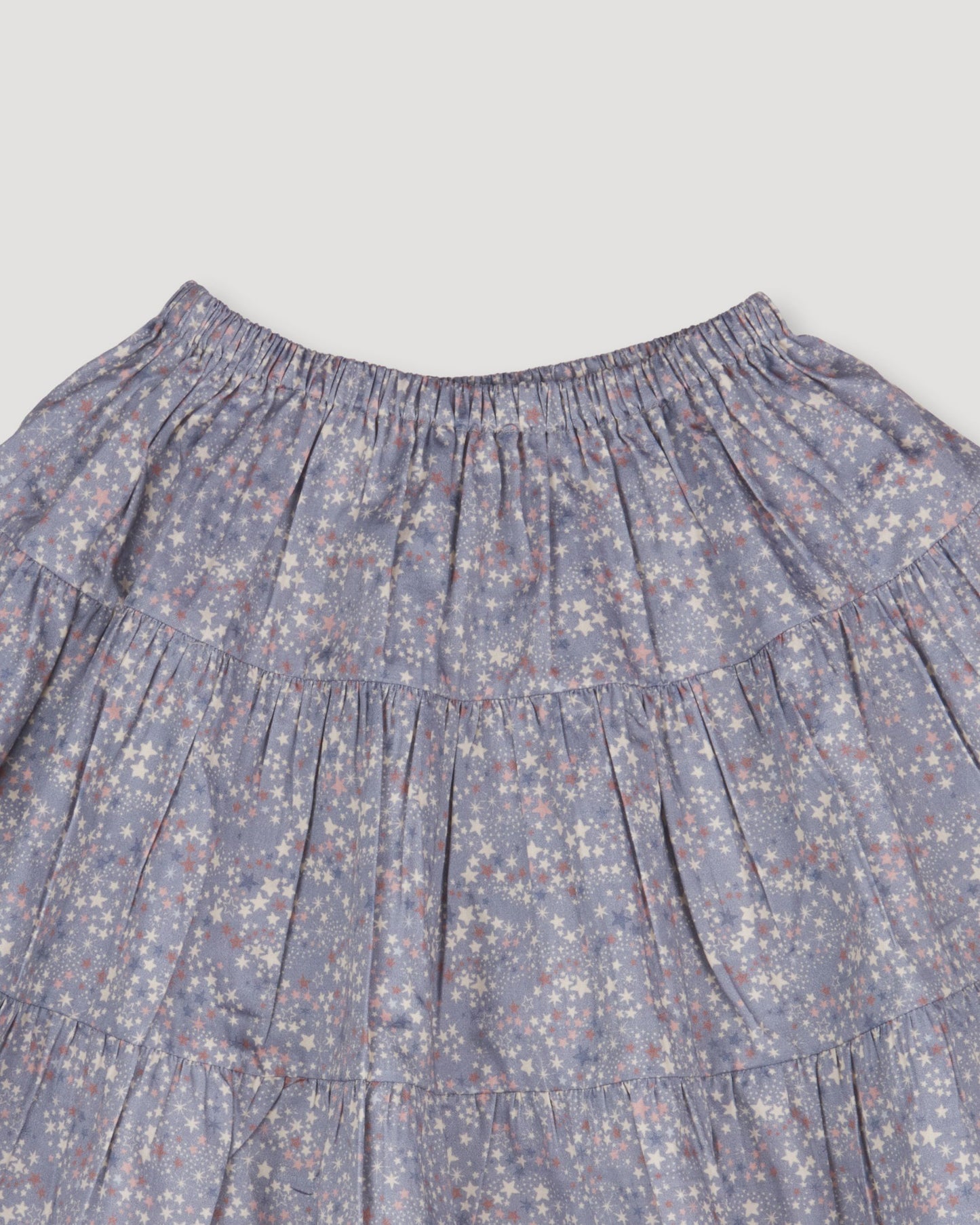 Early Sunday, Victoria Skirt in Celestial print, made from Printed Cotton Satin fabric, featuring Tiered silhouette for natural movement and volume, shown in a closeup flat-lay view
