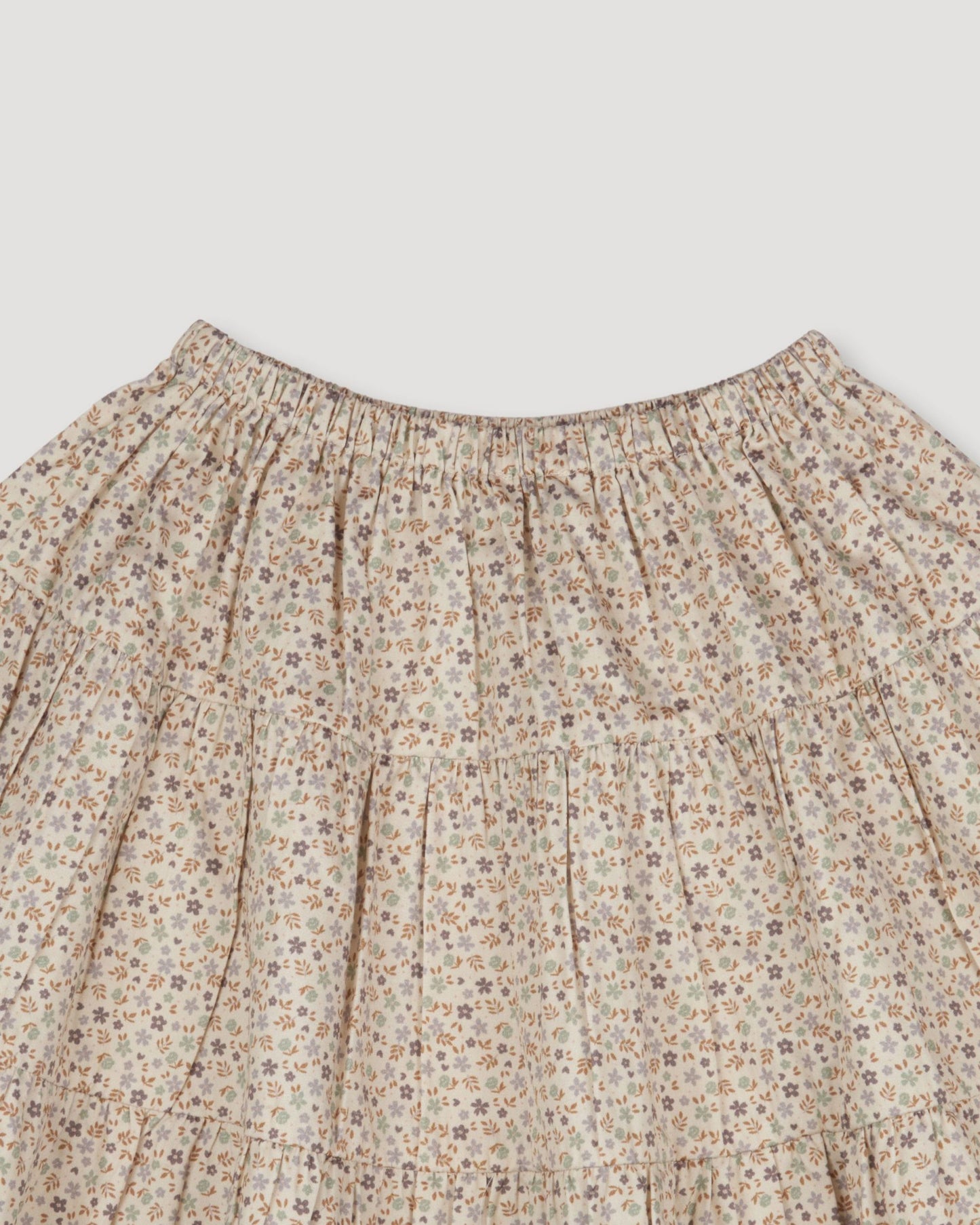 Early Sunday, Victoria Skirt in Miny Flowers print, made from Printed Cotton Satin fabric, featuring Tiered silhouette for natural movement and volume, shown in a closeup flat-lay view