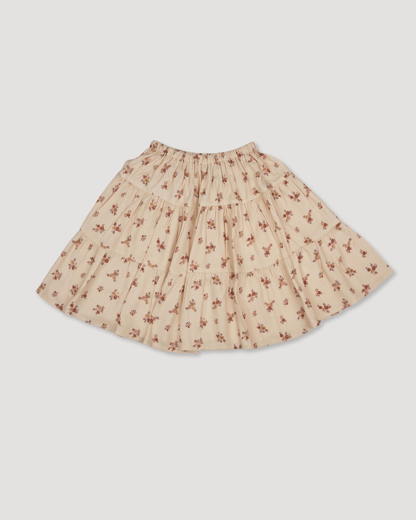 Early Sunday, Victoria Skirt in Ditsy Bouquet Cream print, made from Printed Viscose Rayon Twill fabric, featuring Tiered silhouette for natural movement and volume, shown in a front flat-lay view