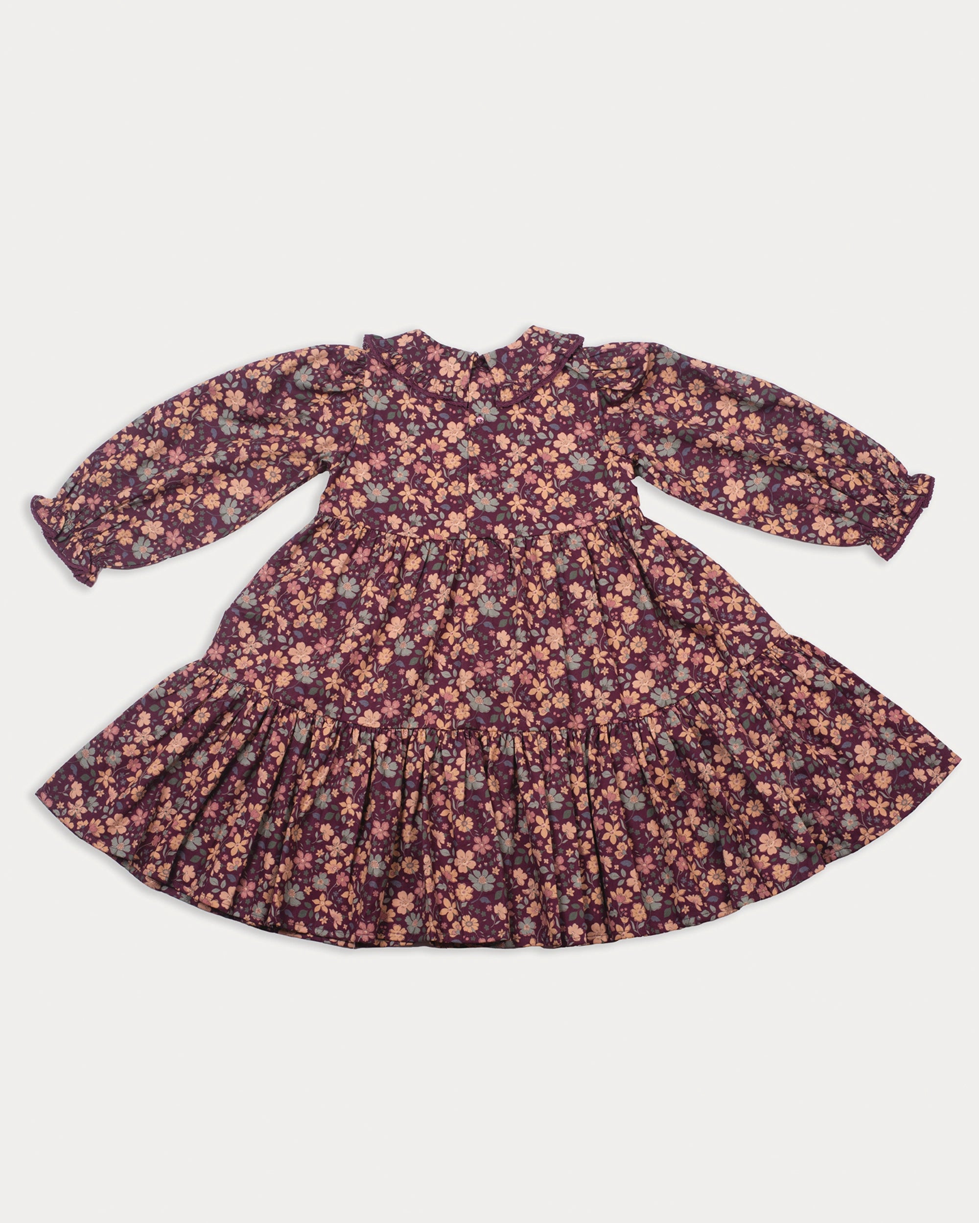 Early Sunday, Marguerite Dress in Garden Flowers Plum, made from Printed Cotton Satin fabric, featuring floral print and detailed lace yoke with Peter Pan collar, shown in a back flat-lay view