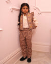 Early Sunday, Adrien Trouser in Bark, made from All-Over Embroidered 30s Cotton Brushed Twill fabric, featuring Relaxed design with ample room for movement, perfect for active kids, shown in a front view of model wearing it