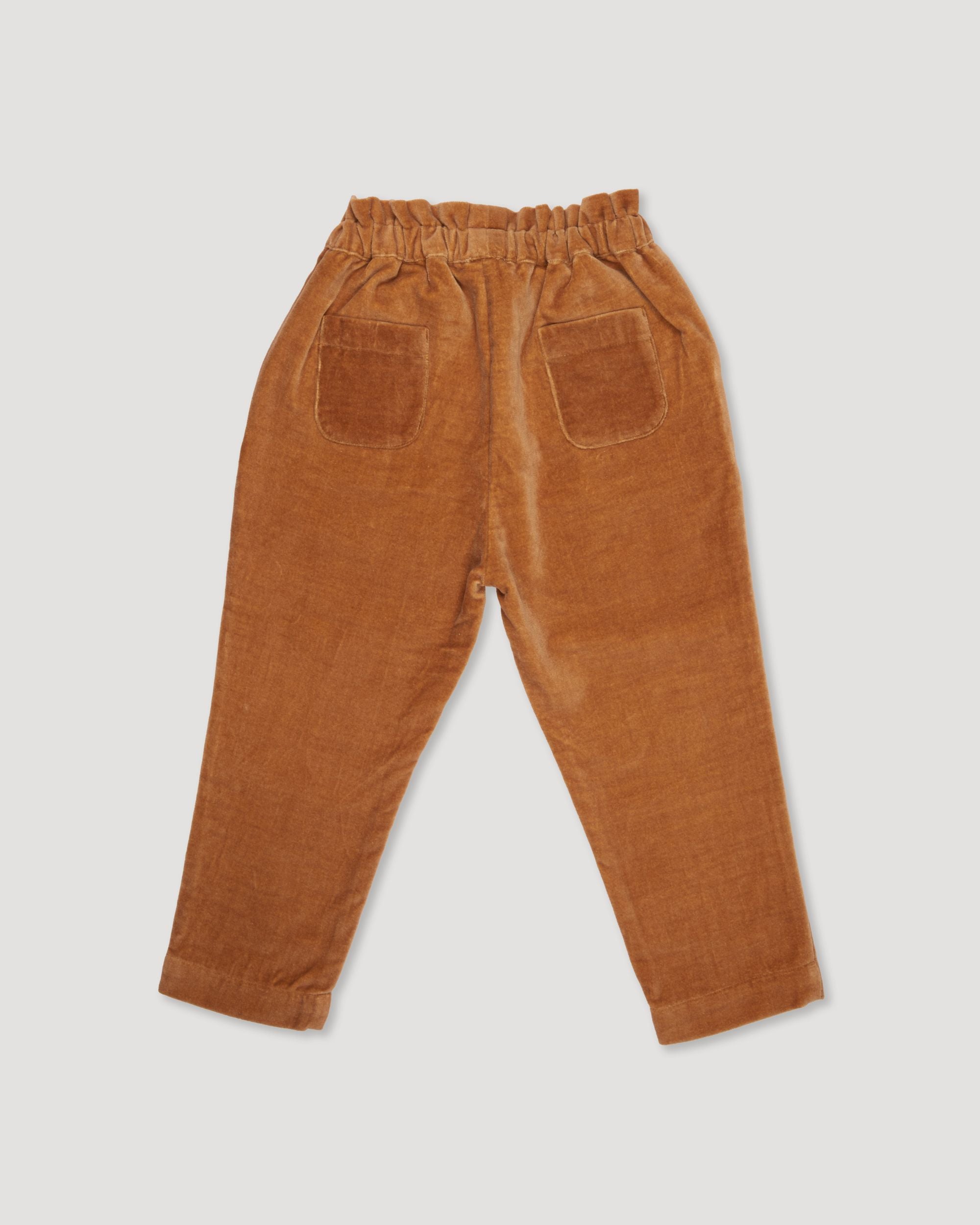 Early Sunday, Adrien Trouser in Almond, made from Dyed Cotton Velvet fabric, featuring Relaxed design with ample room for movement, perfect for active kids, shown in a back flat-lay view