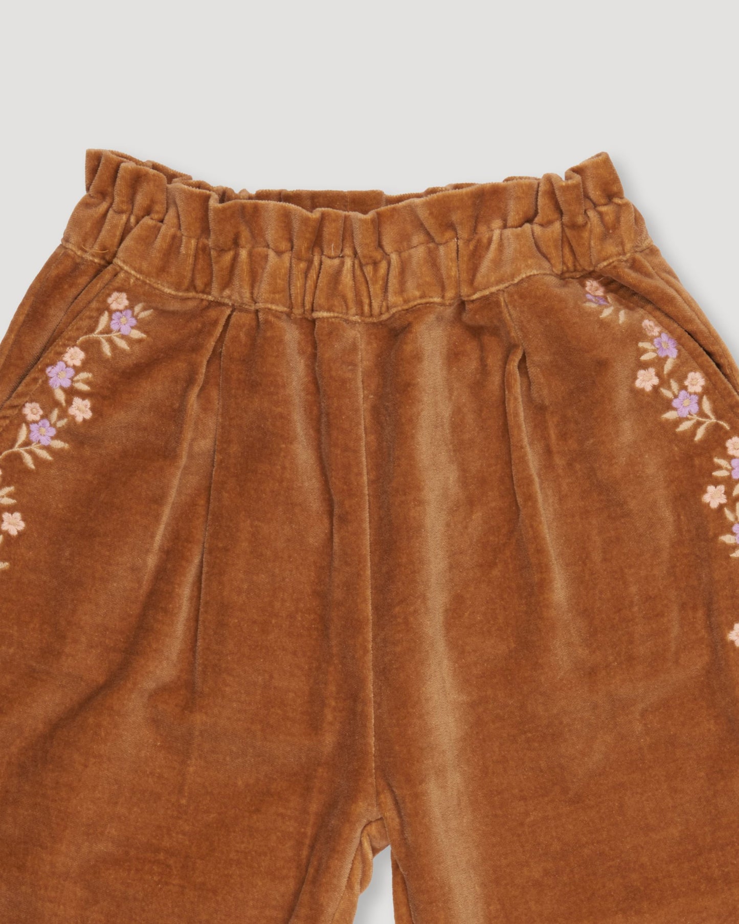 Early Sunday, Adrien Trouser in Almond, made from Dyed Cotton Velvet fabric, featuring Relaxed design with ample room for movement, perfect for active kids, shown in a closeup flat-lay view