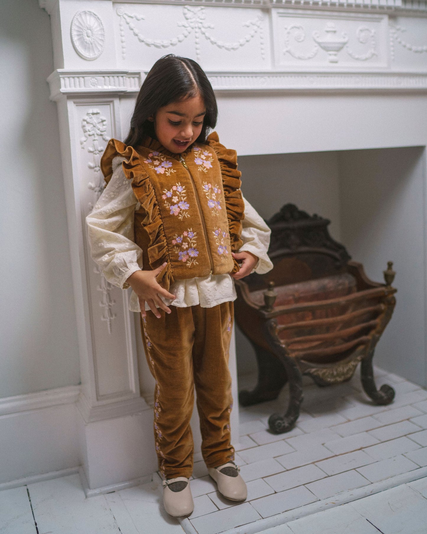 Early Sunday, Adrien Trouser in Almond, made from Dyed Cotton Velvet fabric, featuring Relaxed design with ample room for movement, perfect for active kids, shown in a front view of model wearing it